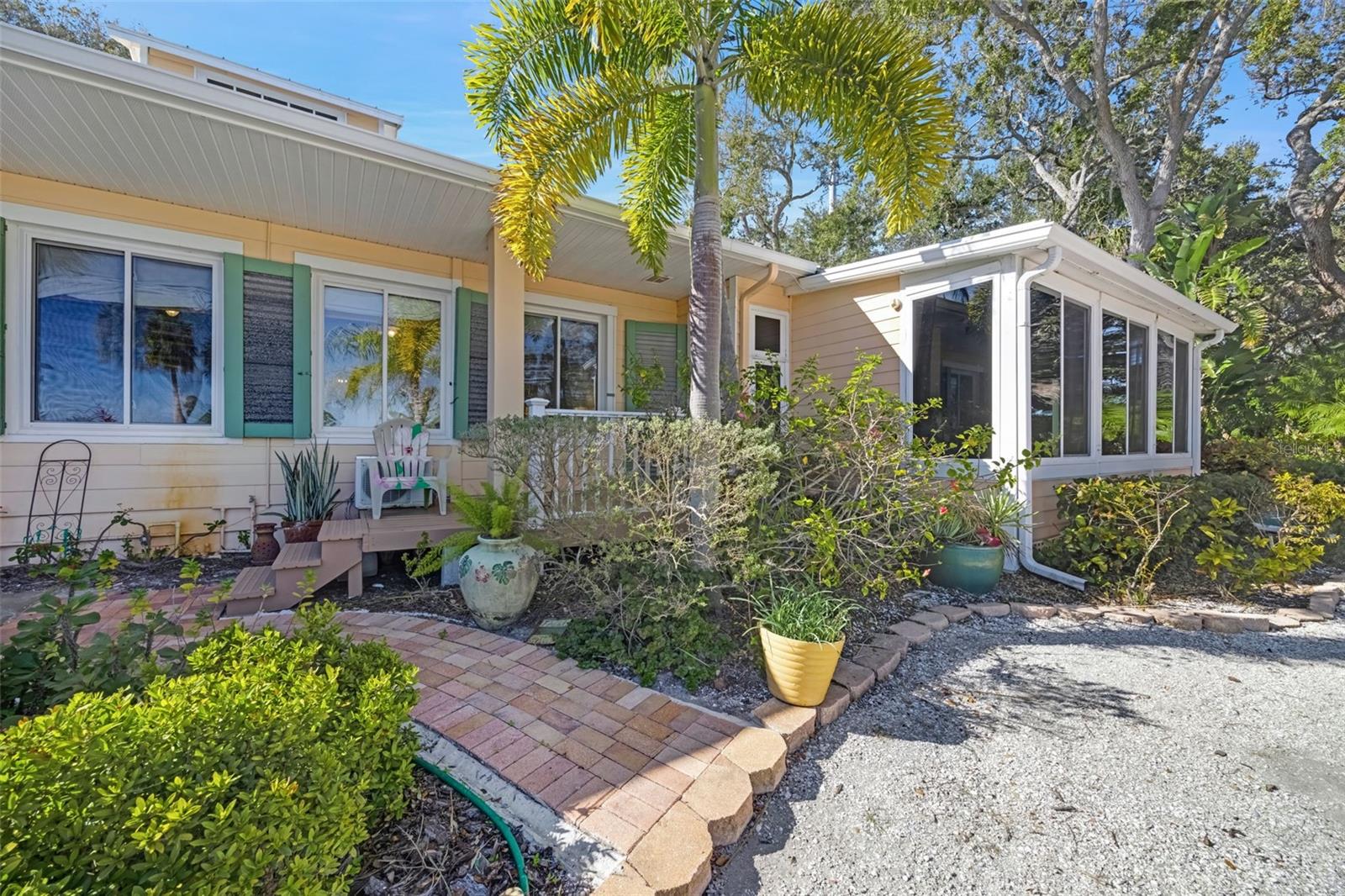 Front view showing open porch and sun room