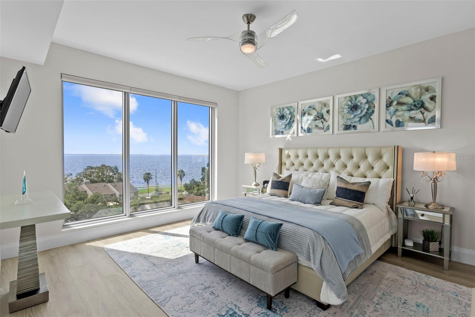 Primary bedroom with east facing sunset and water views