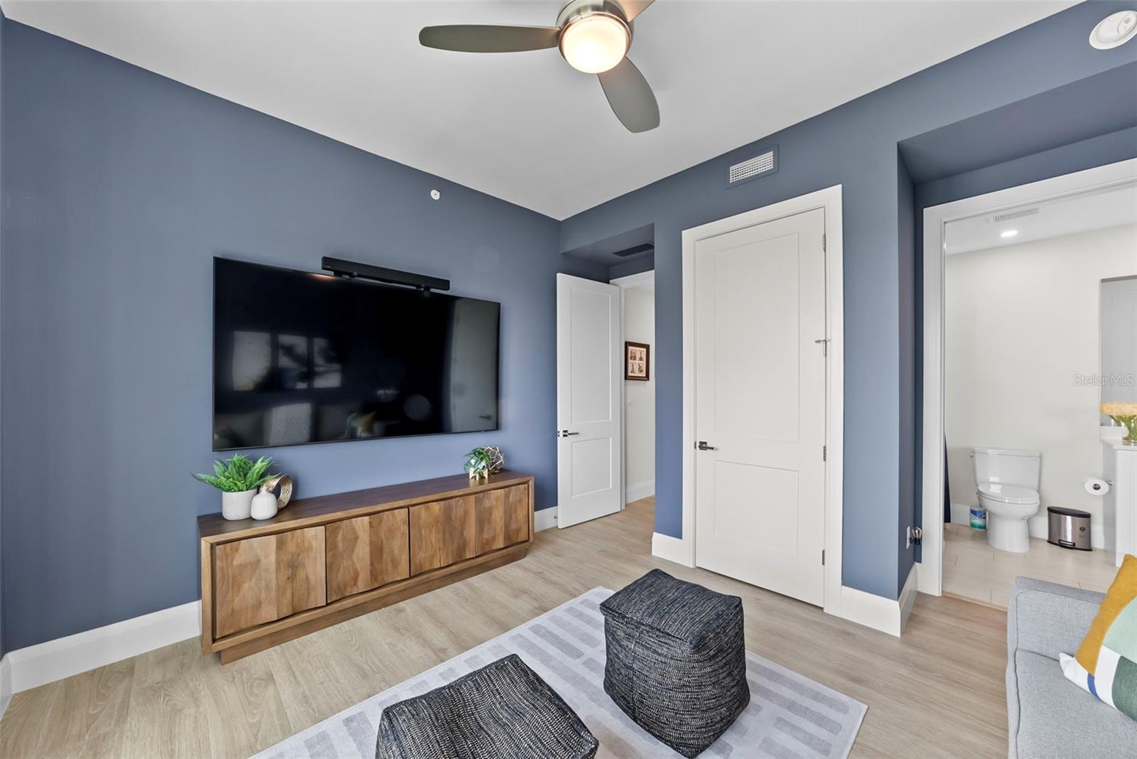 2nd bedroom with door to hallway and door to bathroom