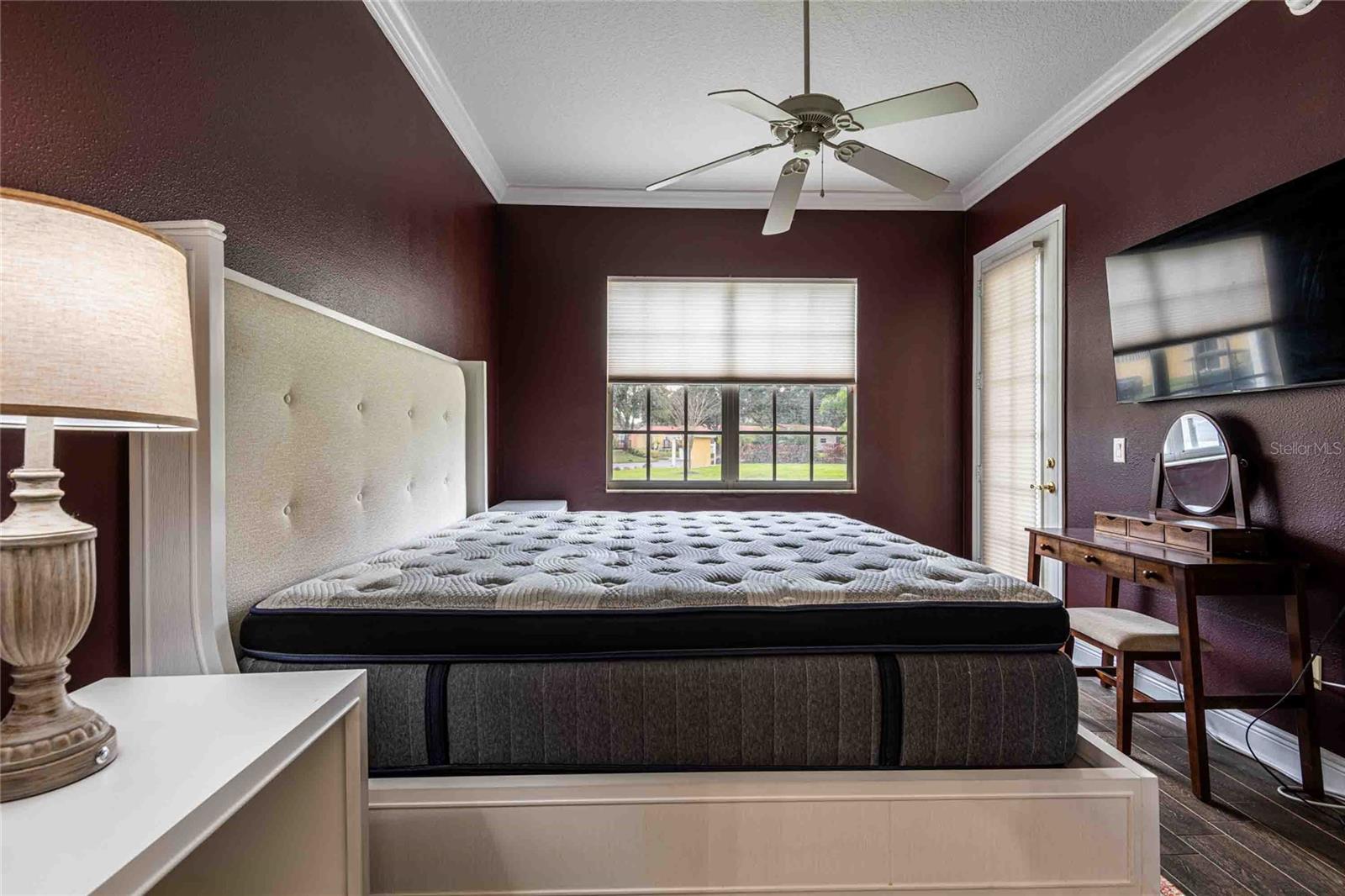 Ling size bed frame, headboard and mattress, plus small desk and Tv.