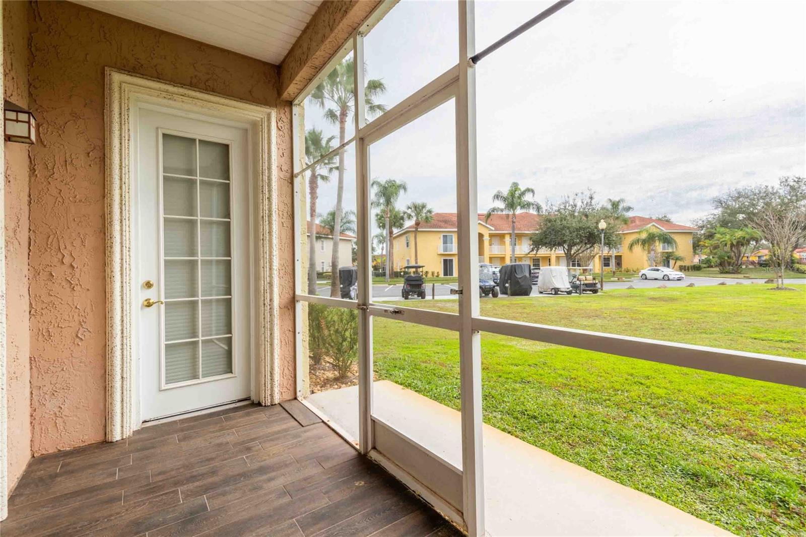 Master bedroom door leading to screen lanai.