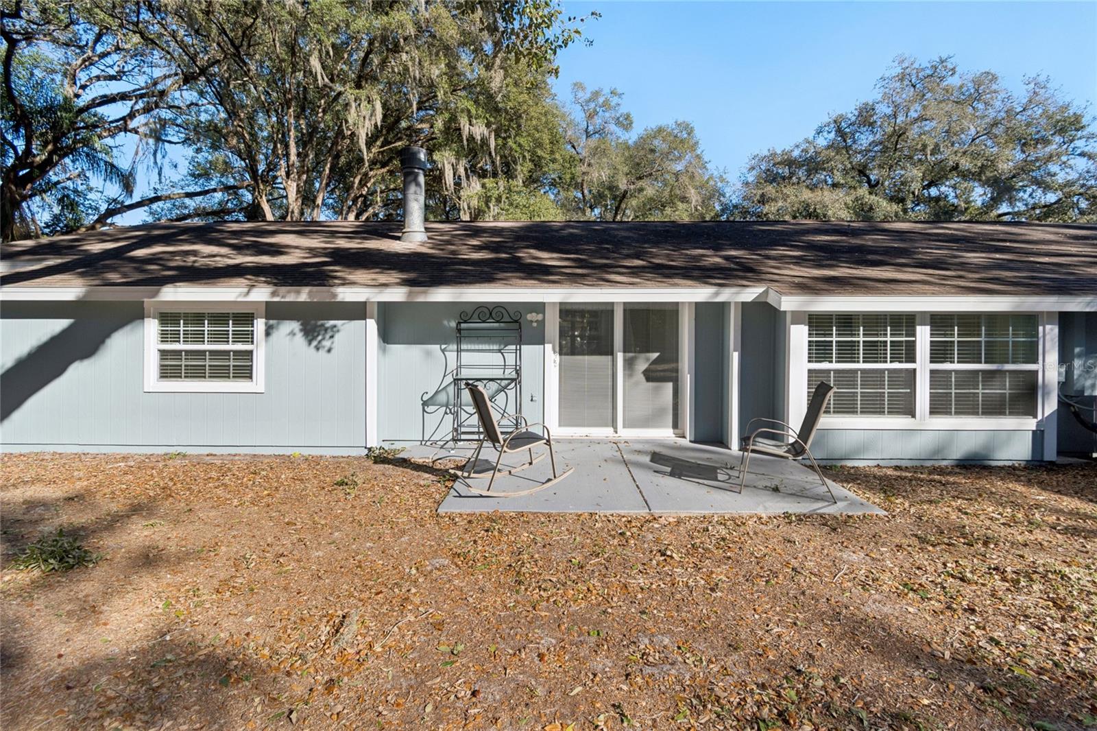 Back of Main House with Sliding Galss Doors to Patio