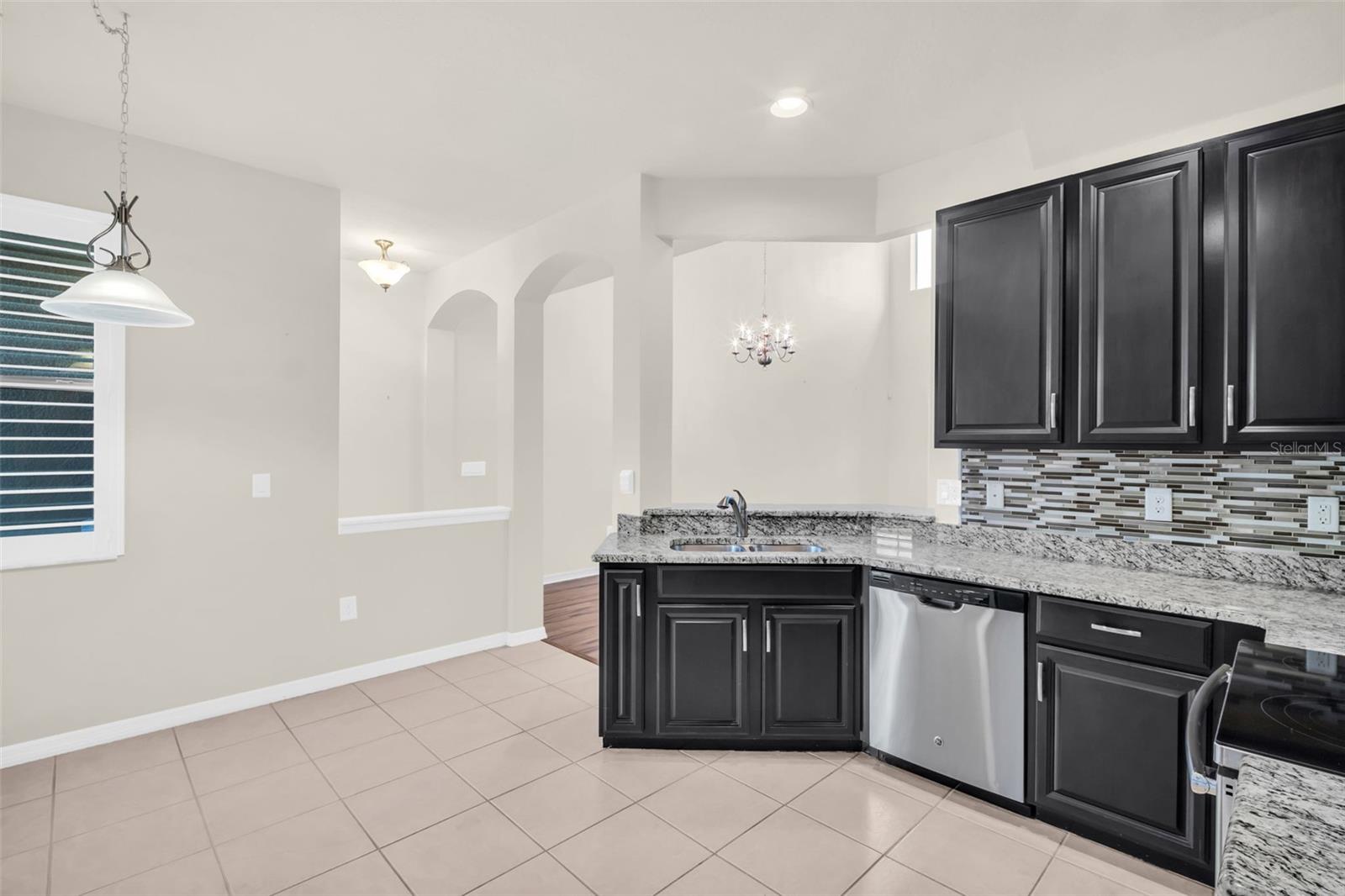 Convenient window pass-through & bar seating open to main living~