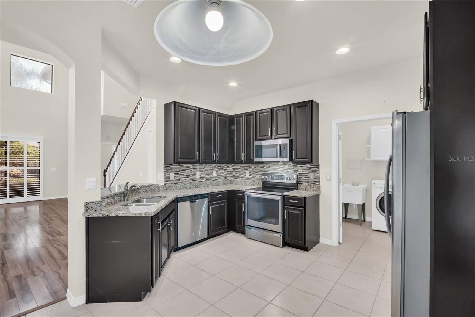 Kitchen leads to the spacious laundry room~