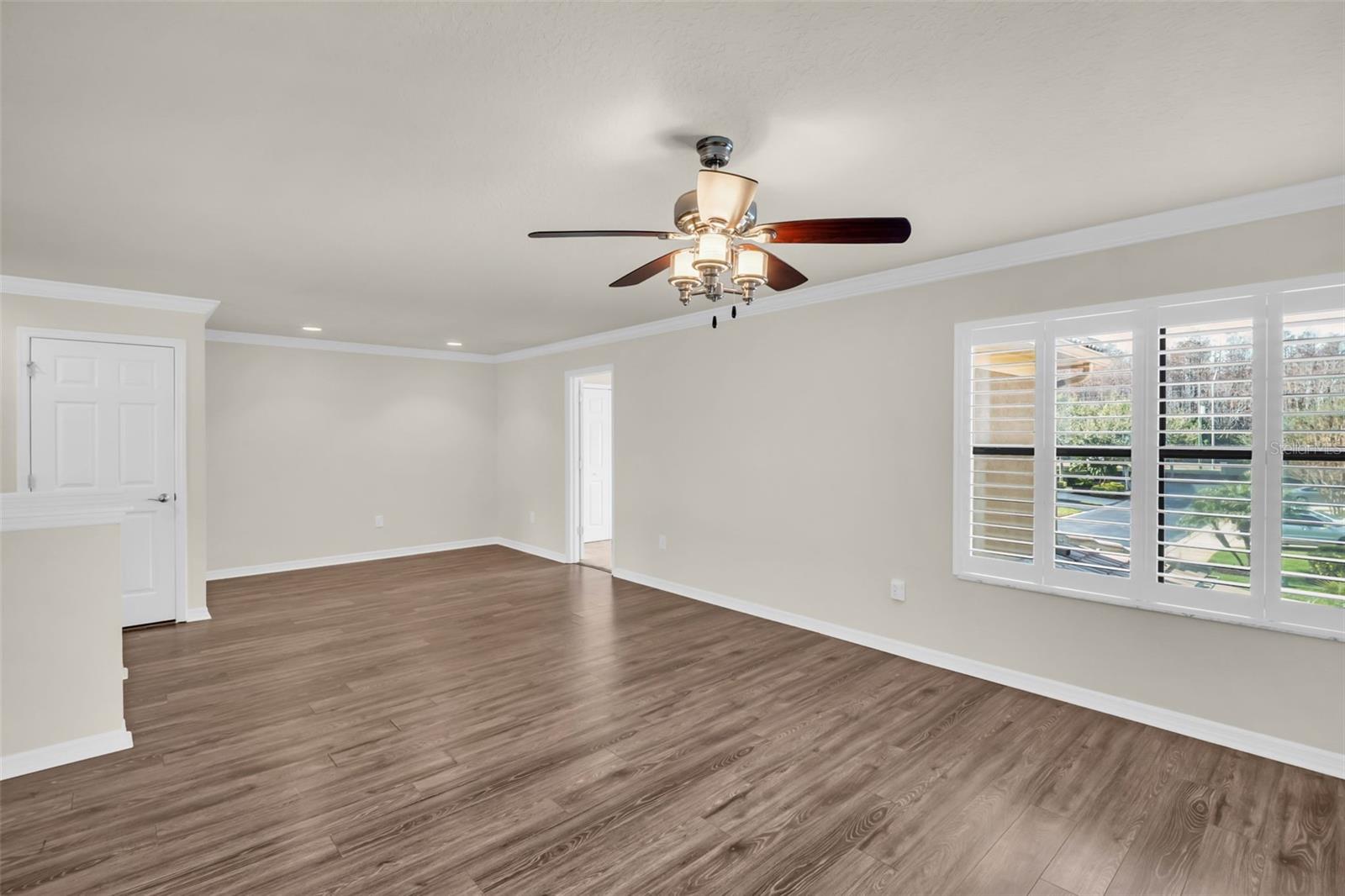 Large windows & beautiful plantation shutters~