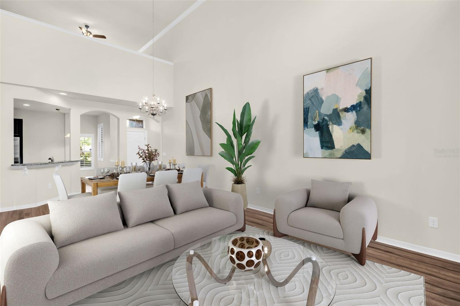 Newer wood-like laminate plank flooring, neutral colors, & crown molding~ VIRTUALLY STAGED