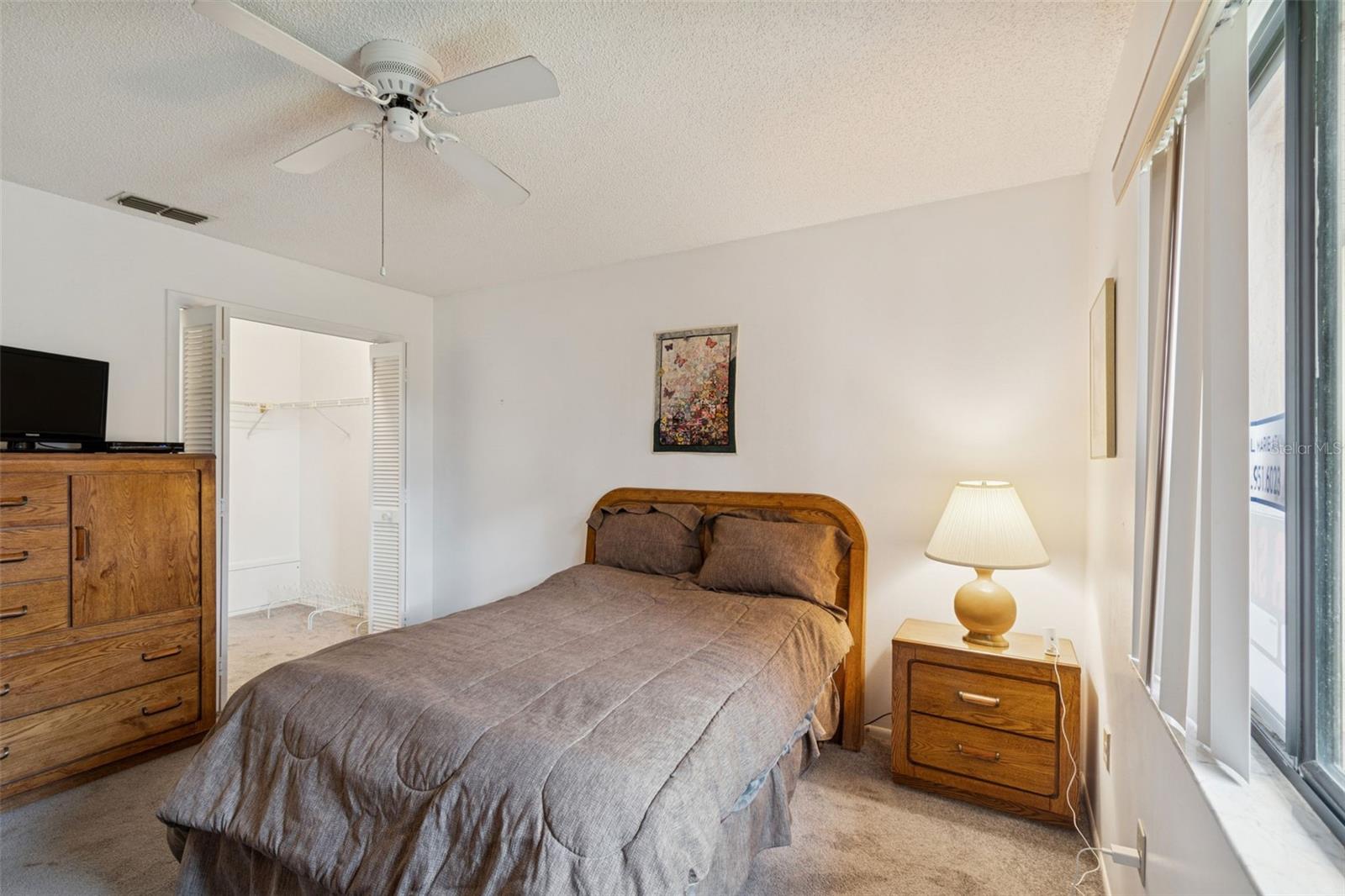 Primary Bedroom with ceiling fan.