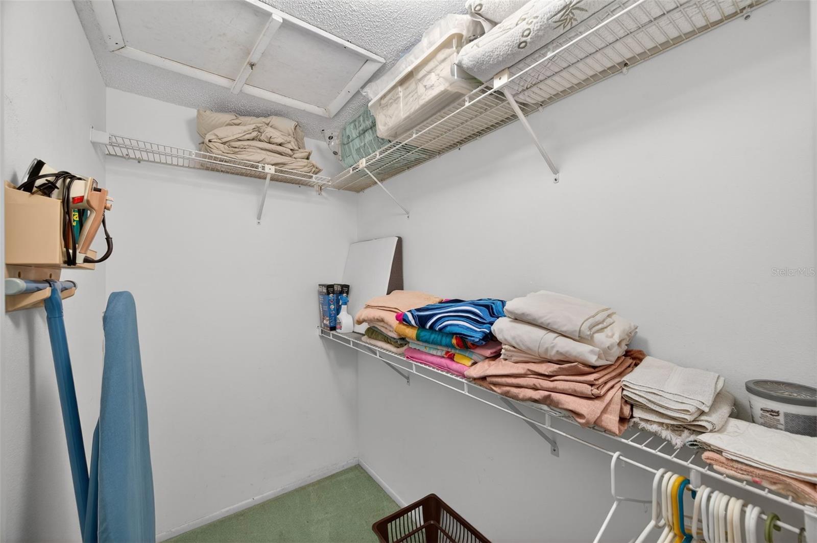 Walk in closet in primary bedroom