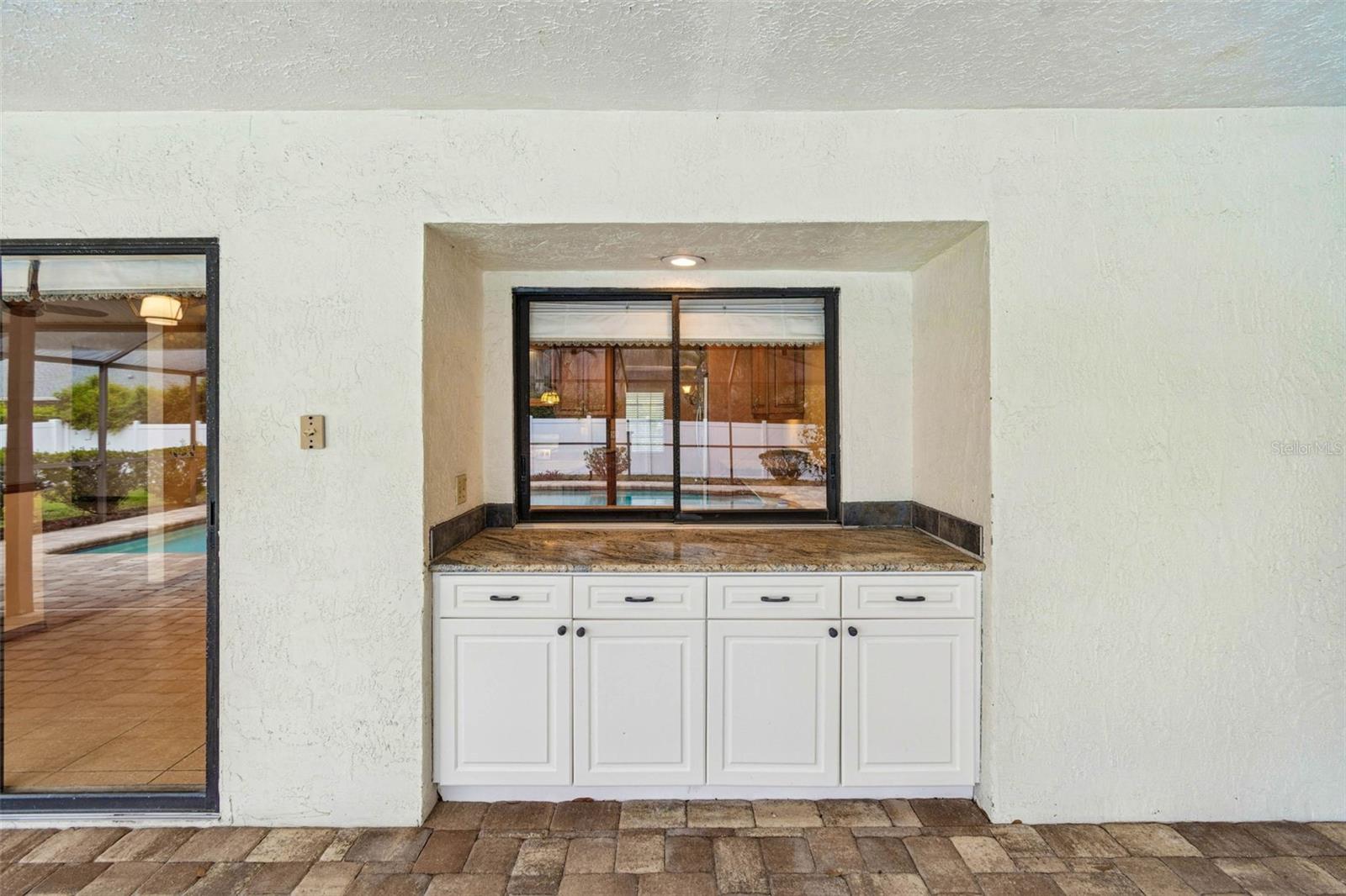 pass through to kitchen for easy entertaining and additional storage