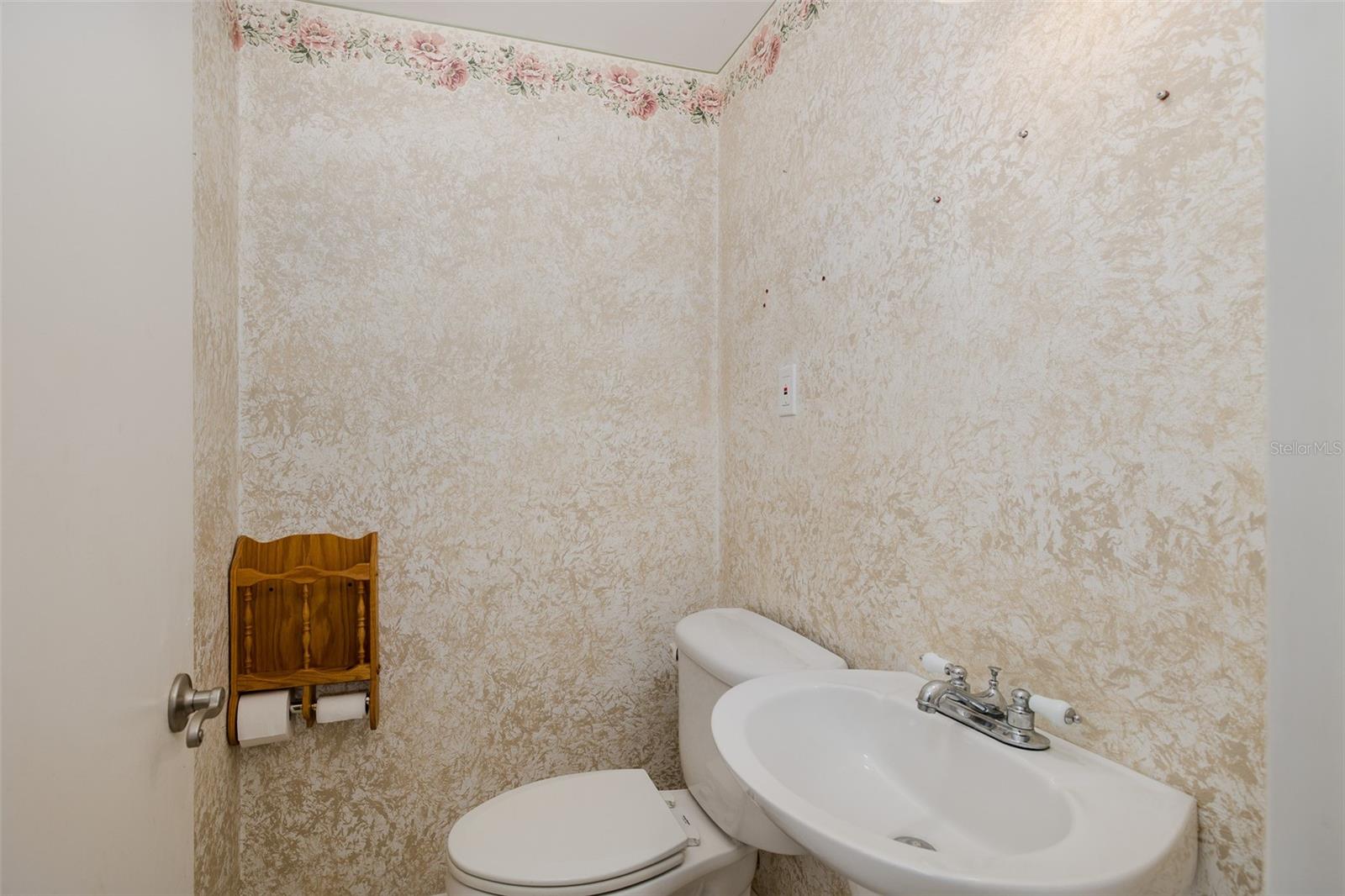 Half bath between garage and kitchen