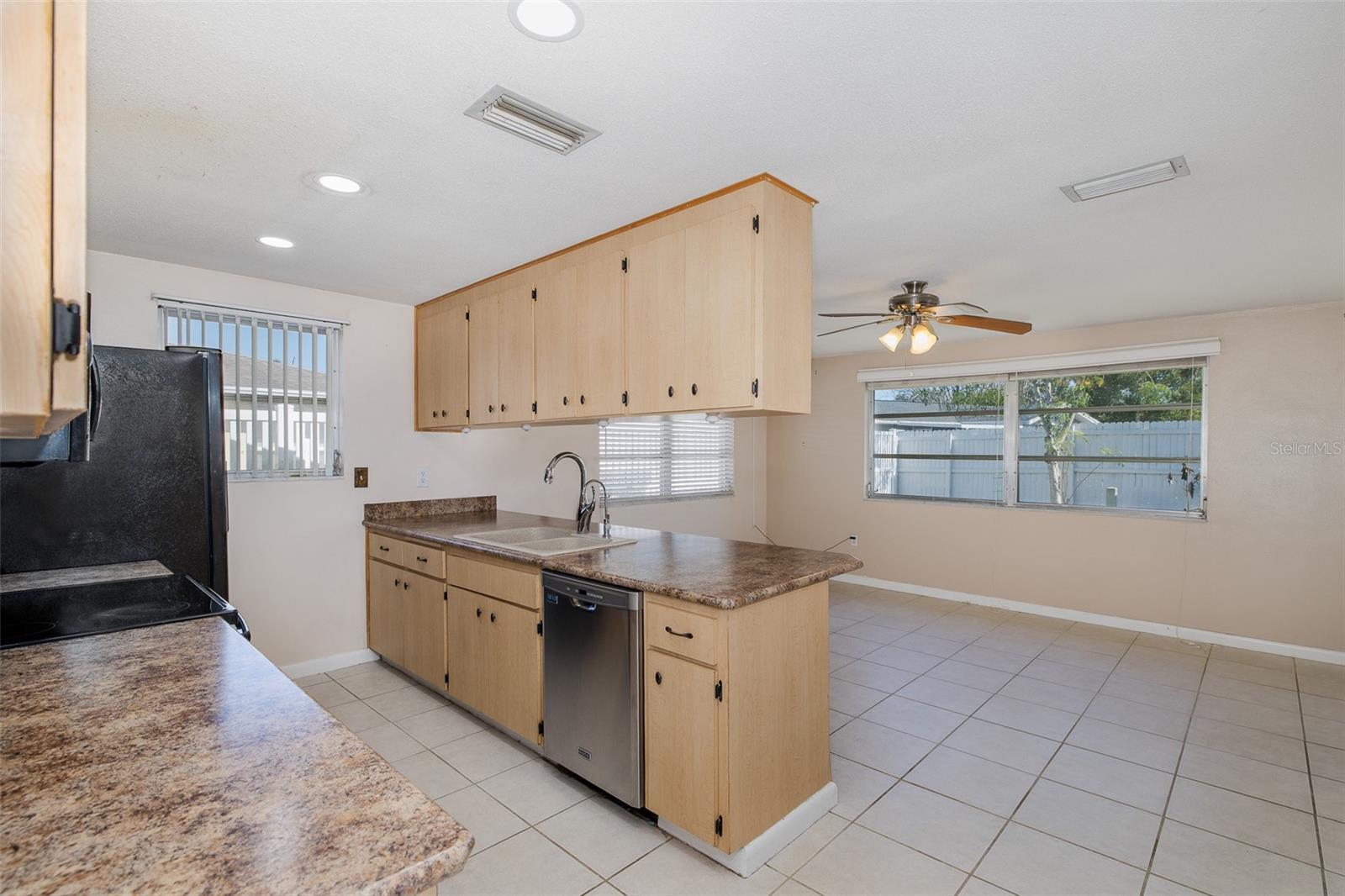 Kitchen opens up into a bright and spacious family room