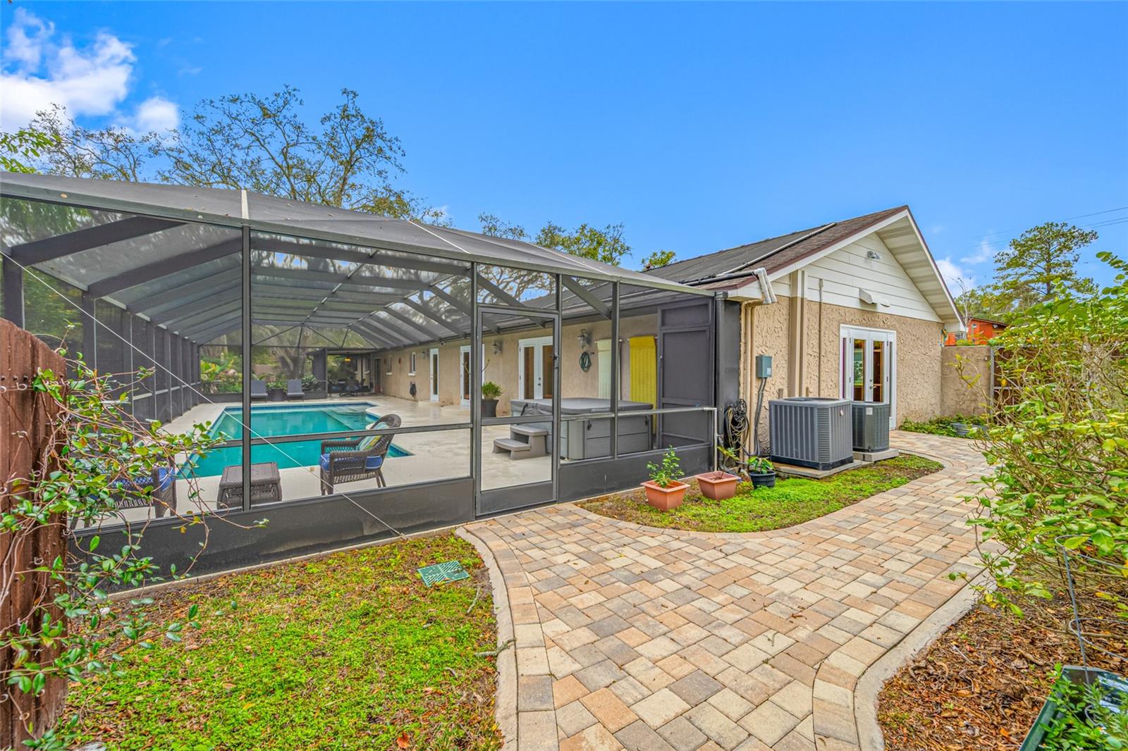 Paver walkway leading to Primary Bedroom #1
