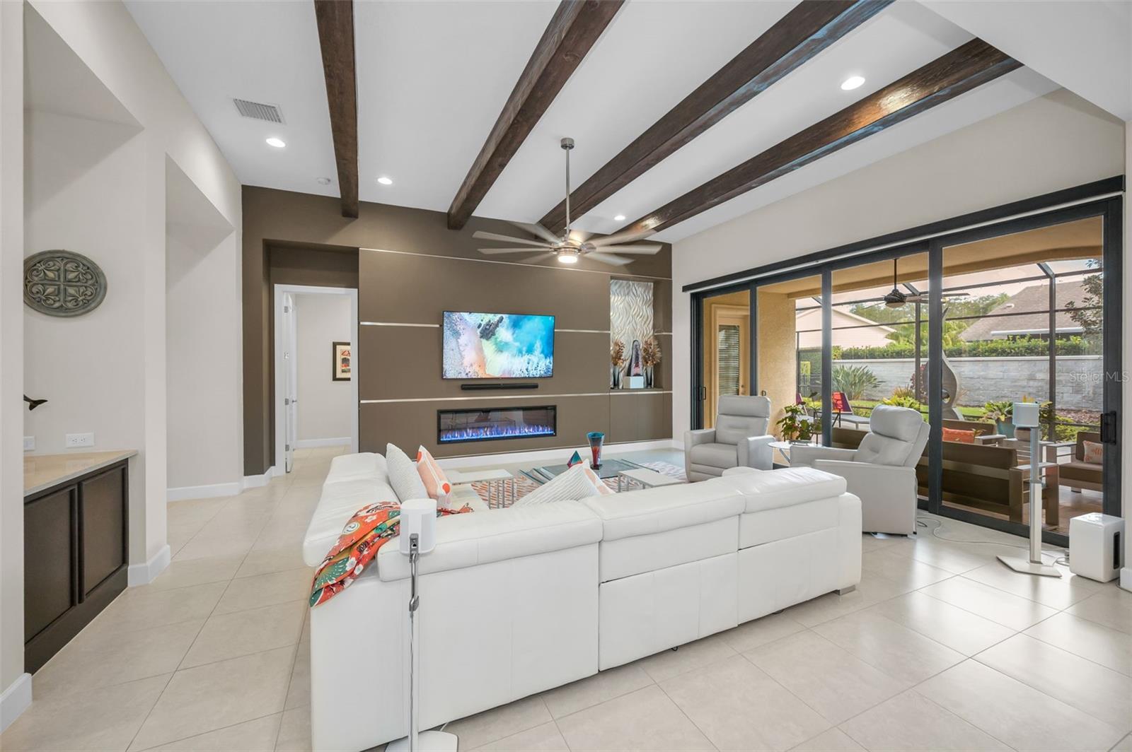 Rich ebony beams in great room