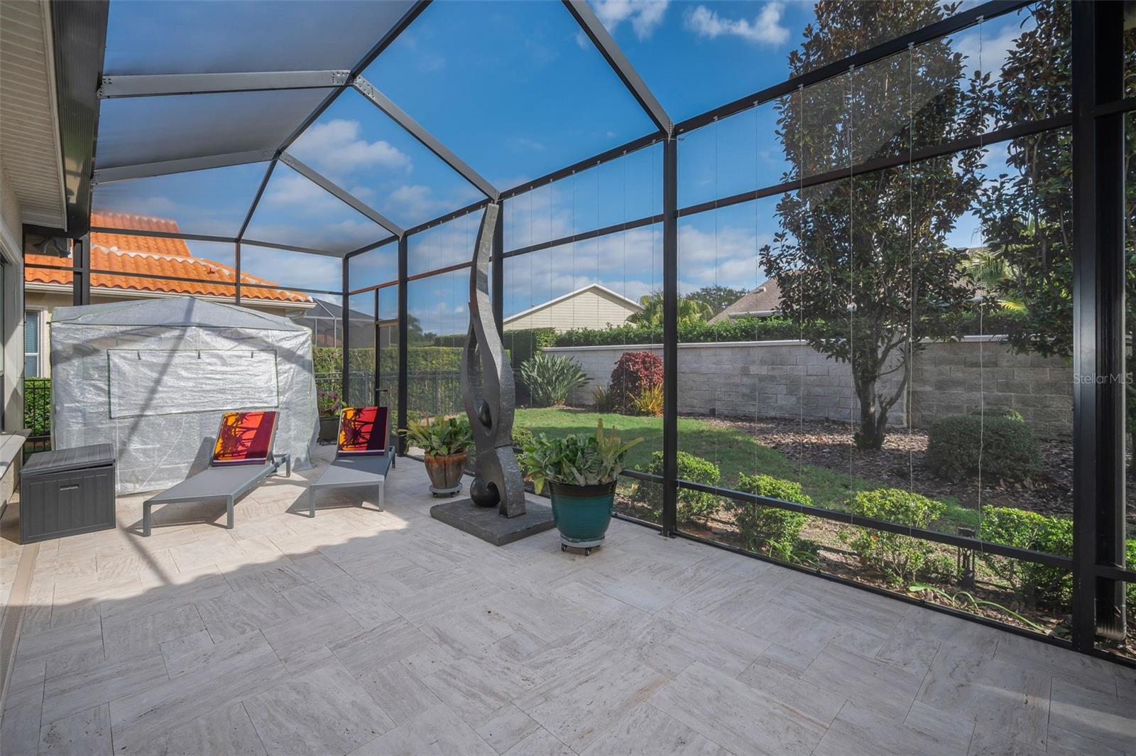 Screened lanai with twinkling lights for evening entertaining
