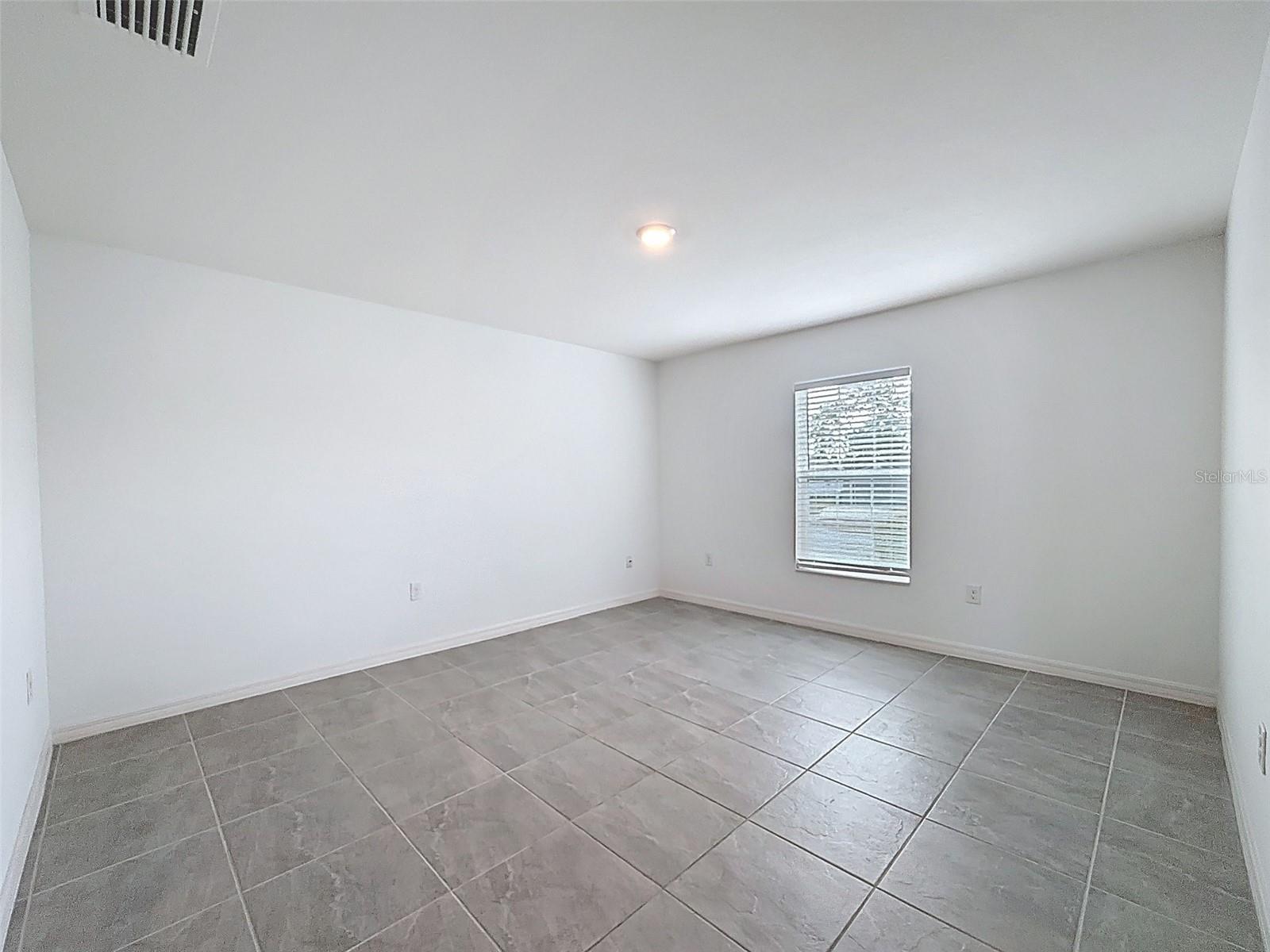 TO THE LEFT OF THE ENTRY IS A LARGE DINING ROOM