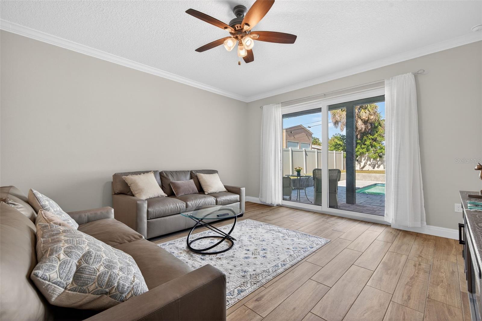Great room with sliders leading to pool