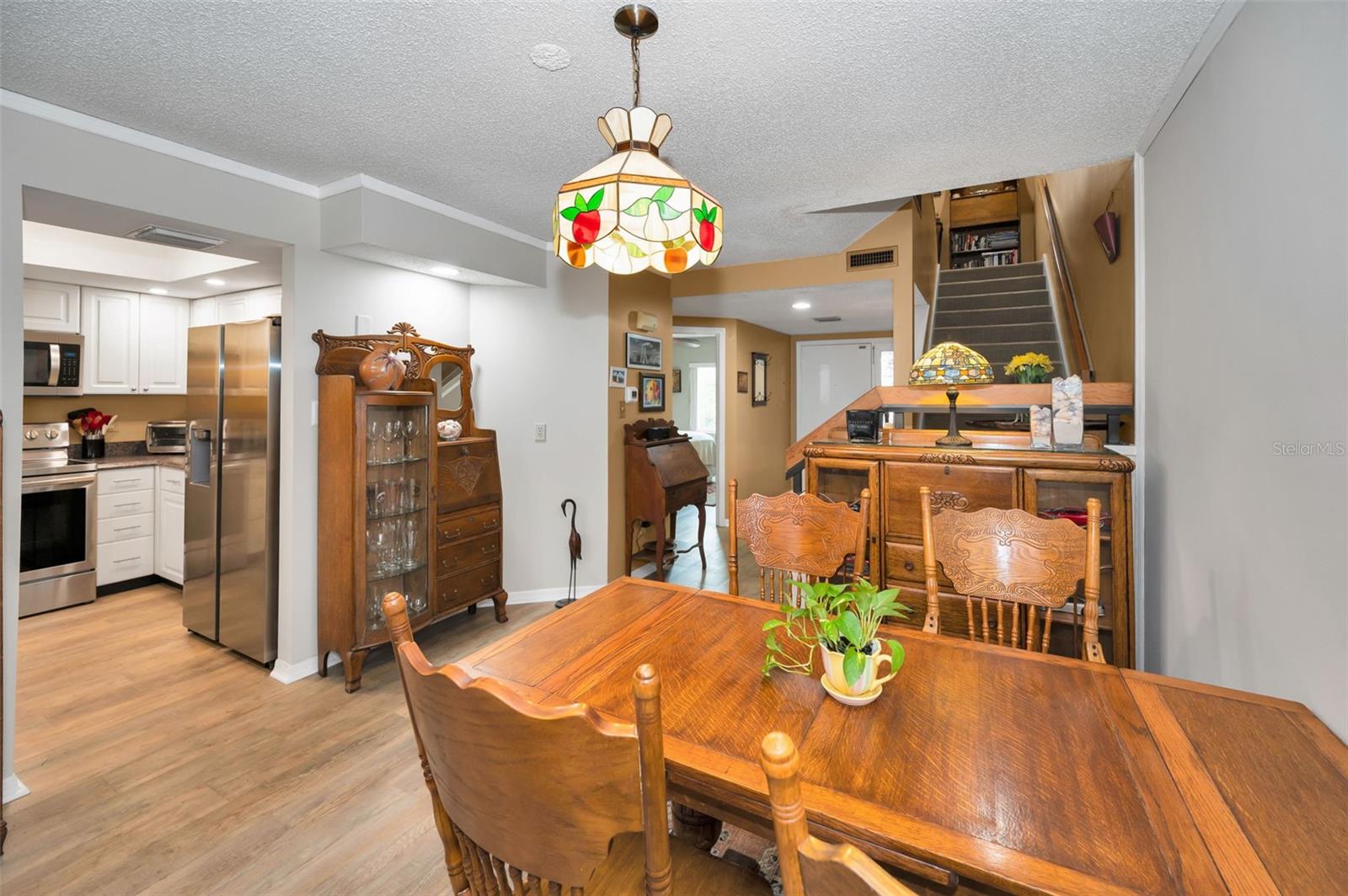 VIEW FROM DINING ROOM TO FOYER AND BED 1 AND BATH