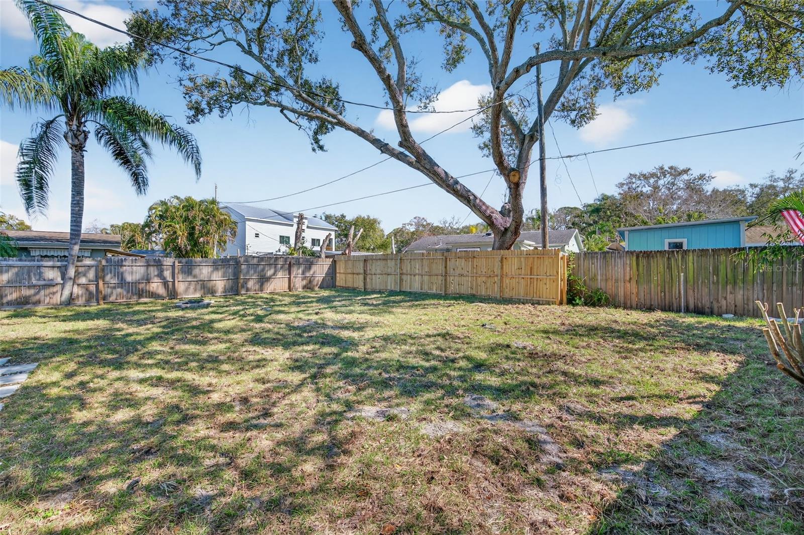 large oversized fenced in backyard.