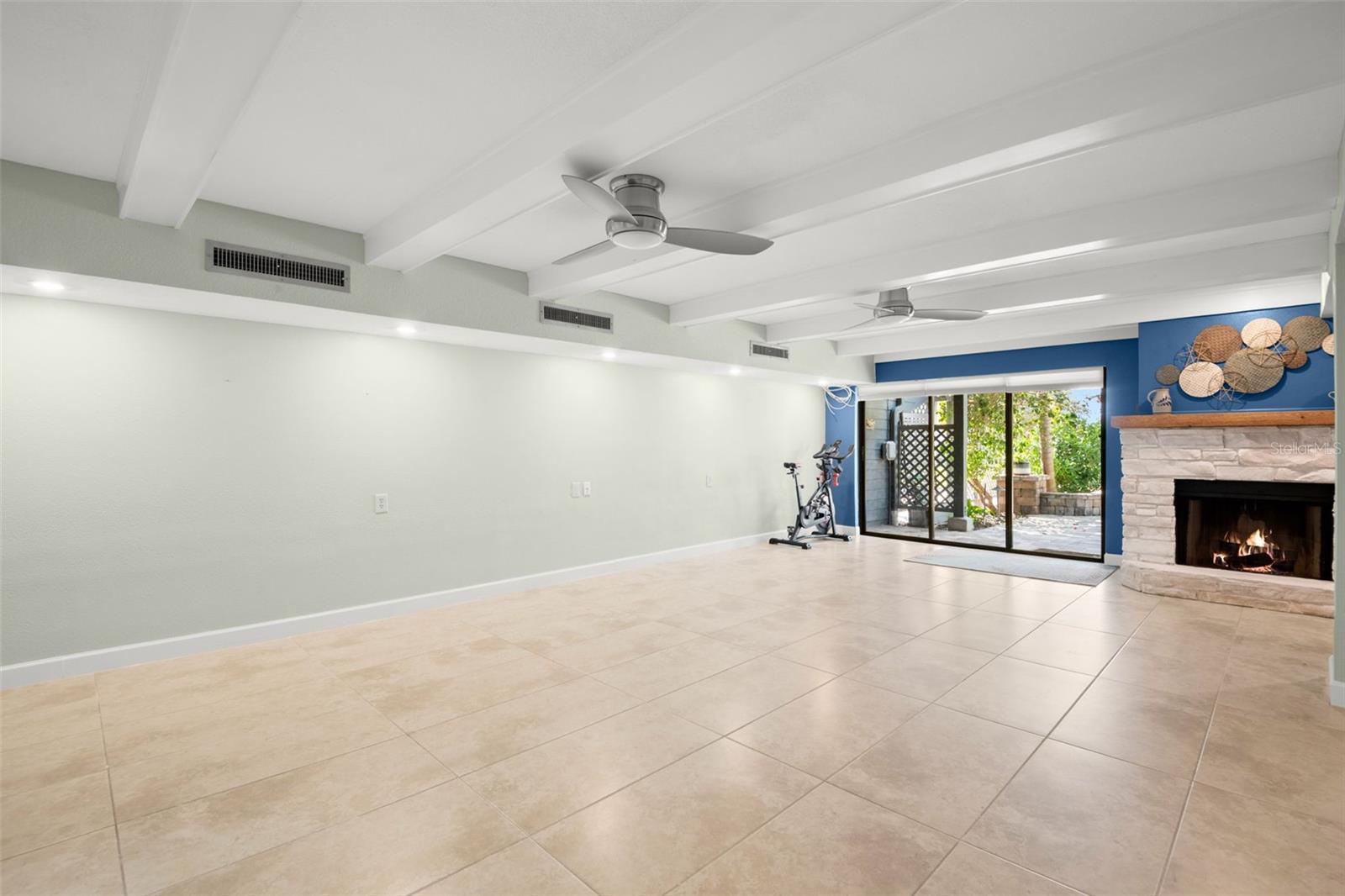 First floor great room with wood burning fireplace