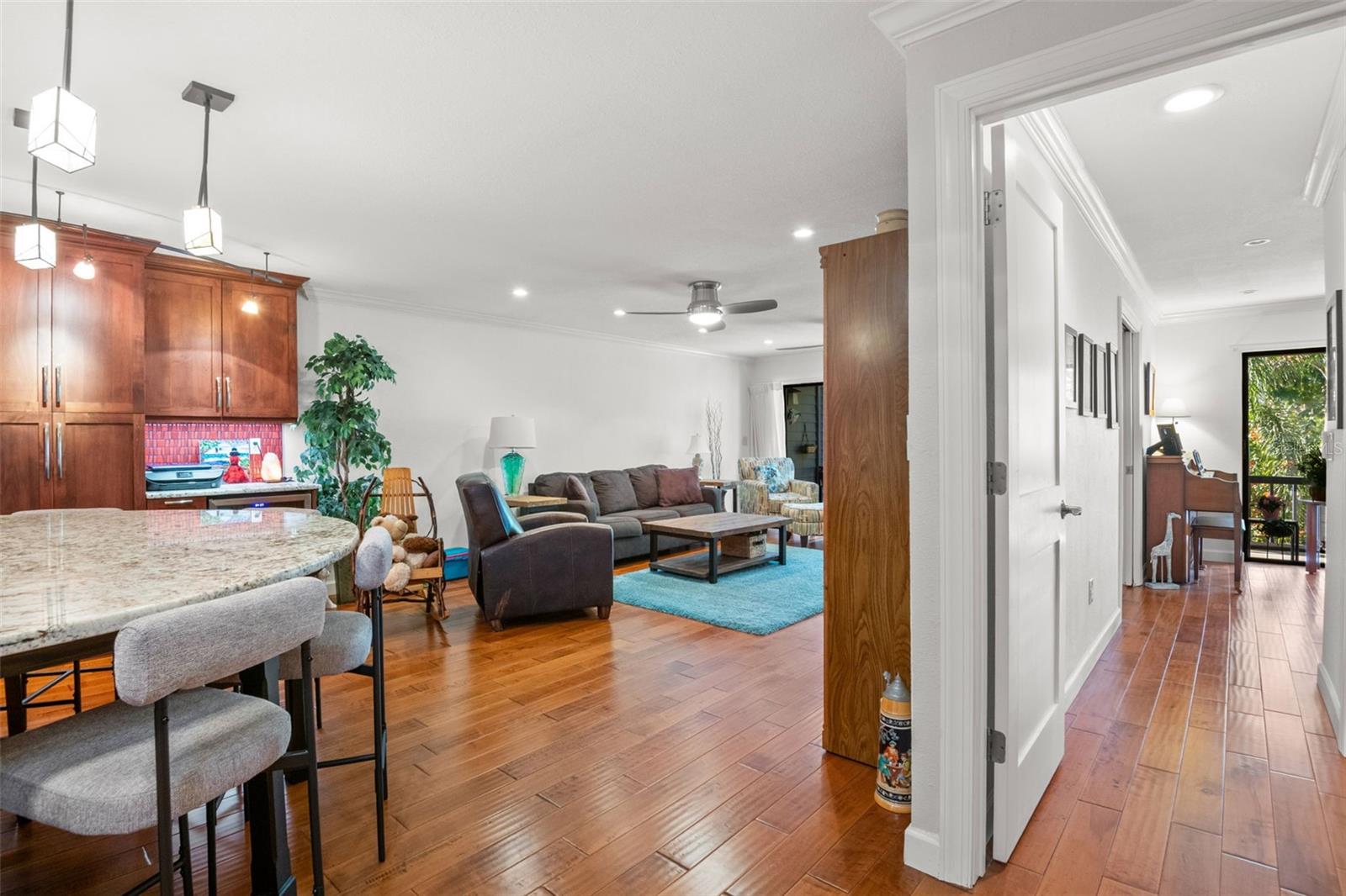 Main entry with open concept living room, kitchen, dining area