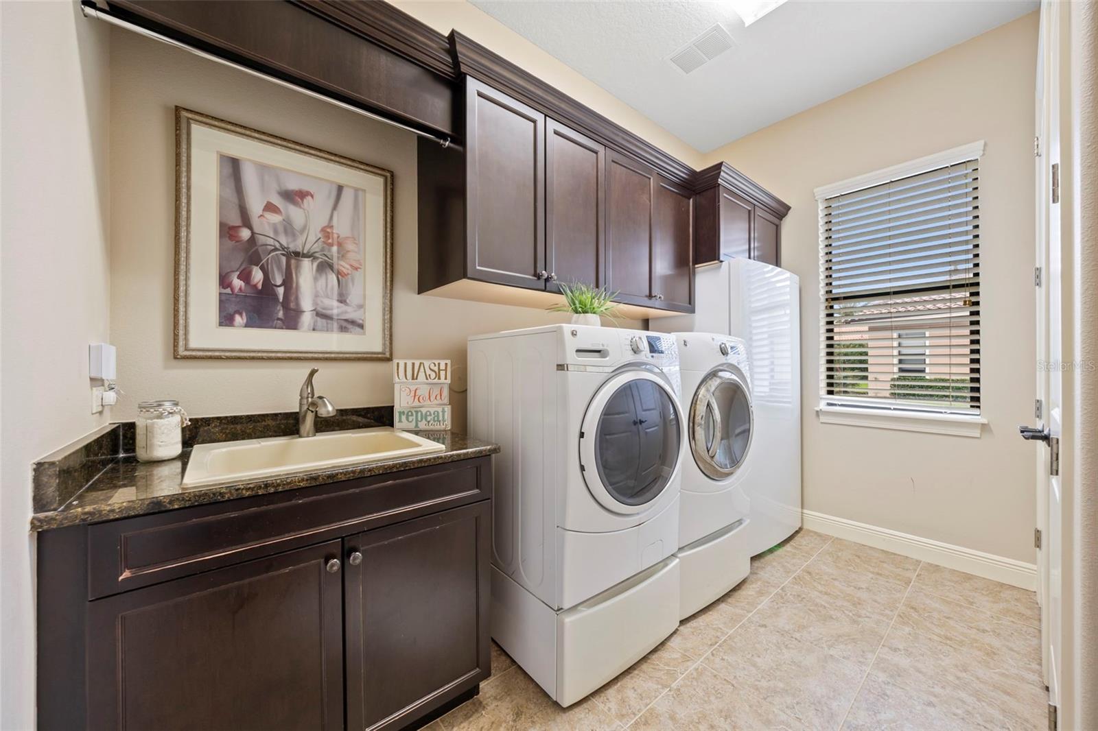 Laundry room with ample storage on main floor