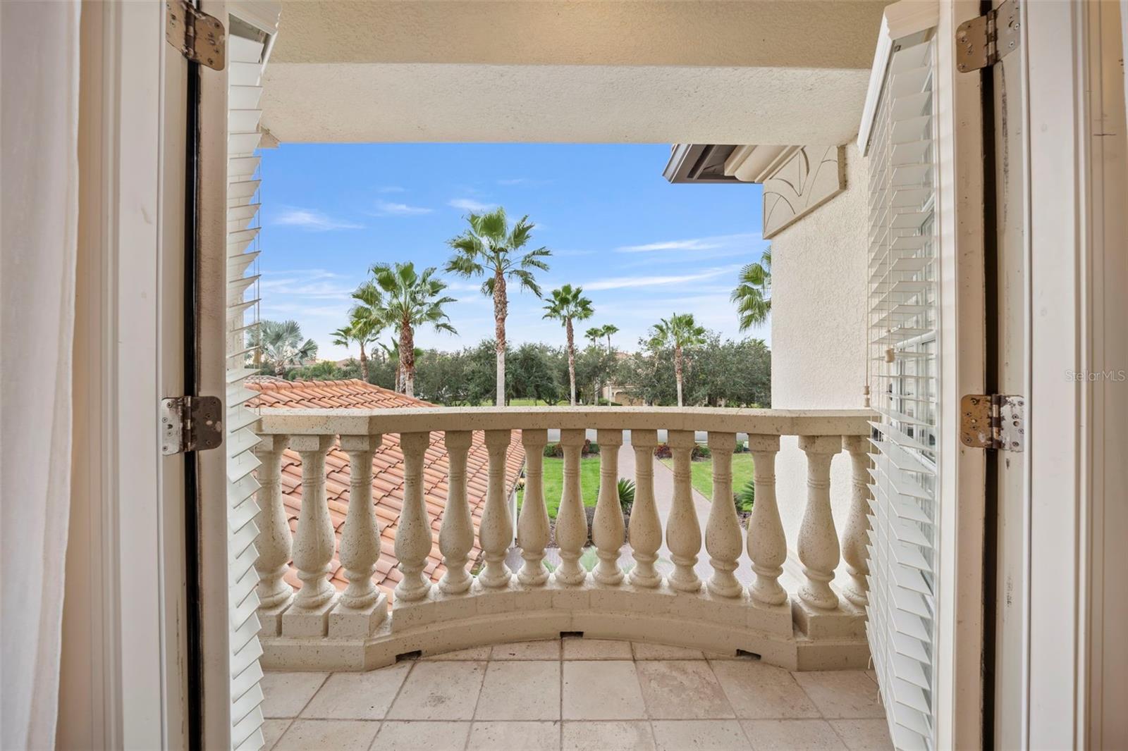 Balcony overlooking front of house from bedroom