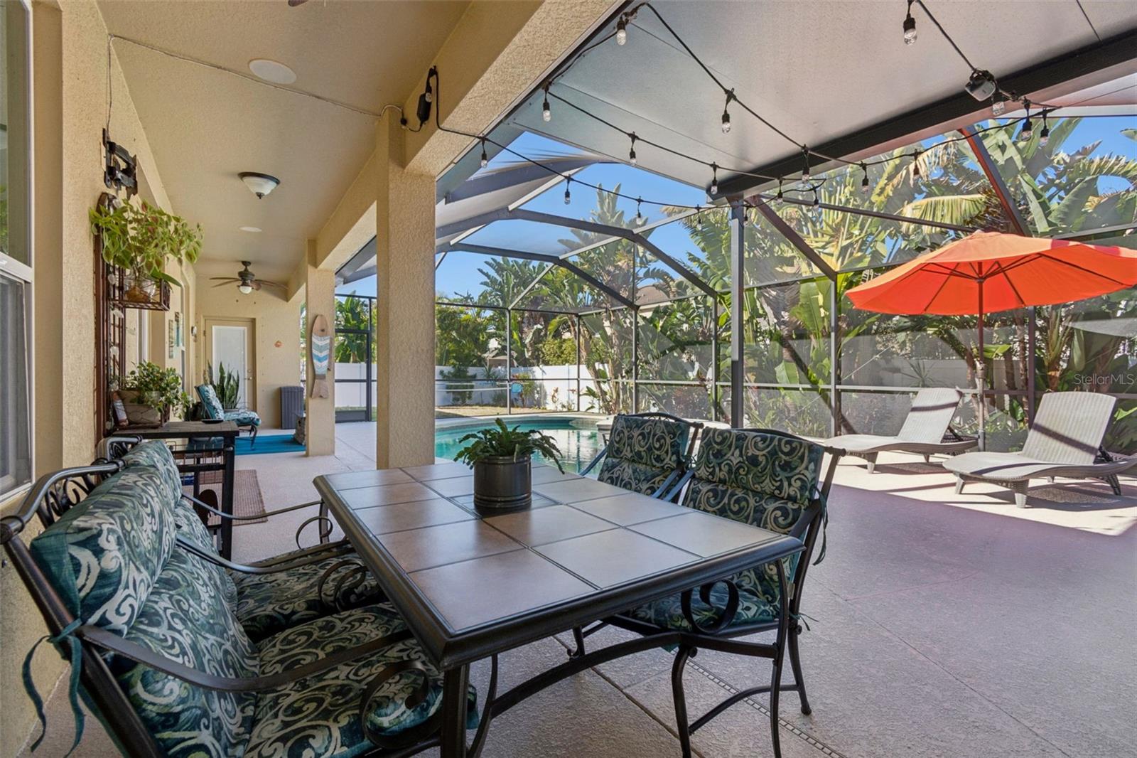 Back lanai contains multiple seating areas - this one is covered with an additional roof for more covered area.