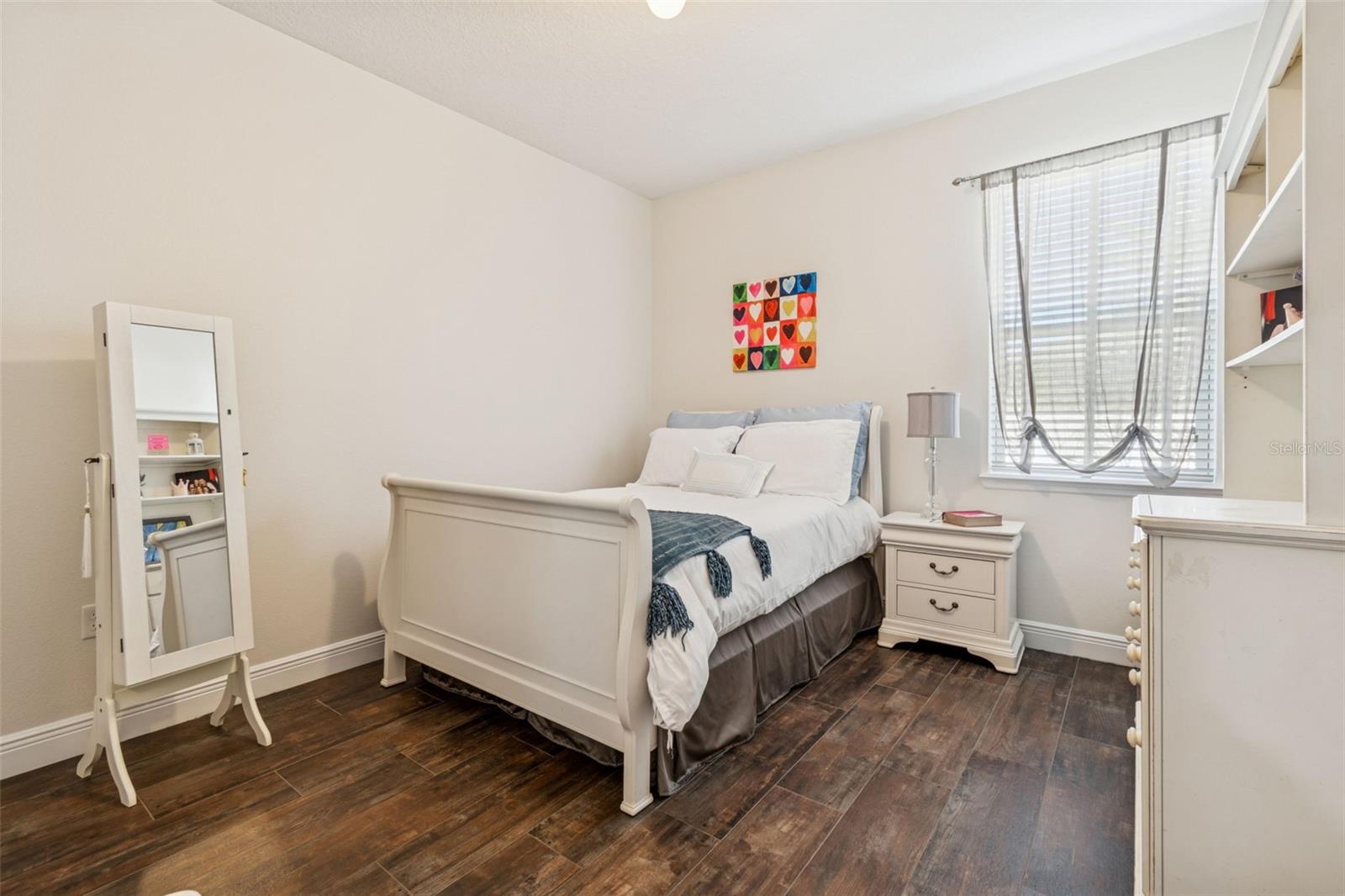 Bedroom 4 - Large room with walk-in closet and newer wood looking tile flooring