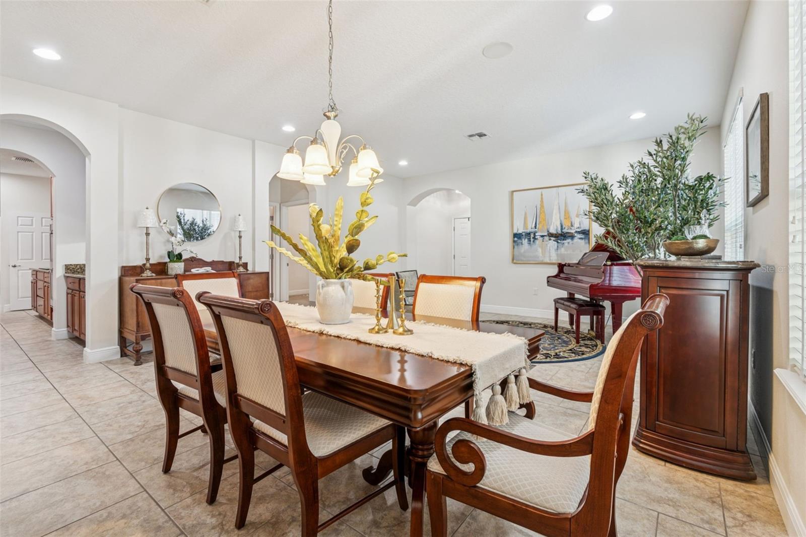 A stylish, light-filled dining area elegant lighting, and an open layout that flows seamlessly into the living space.