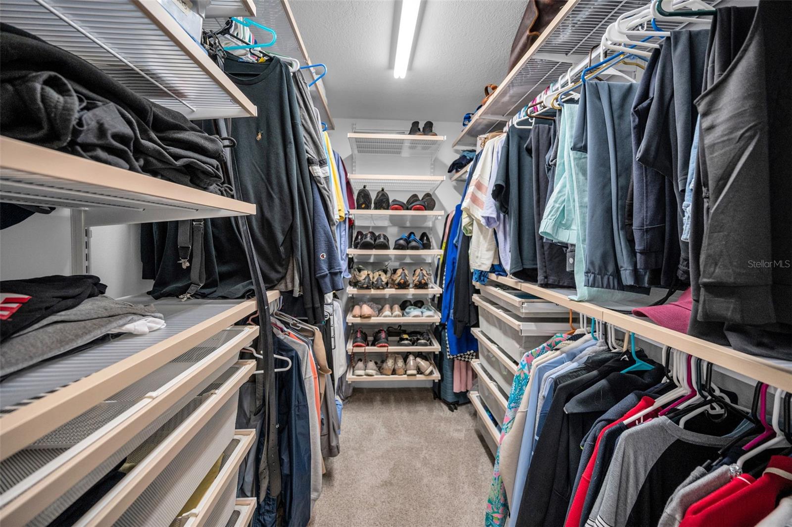 Walk-in closet in primary bedroom
