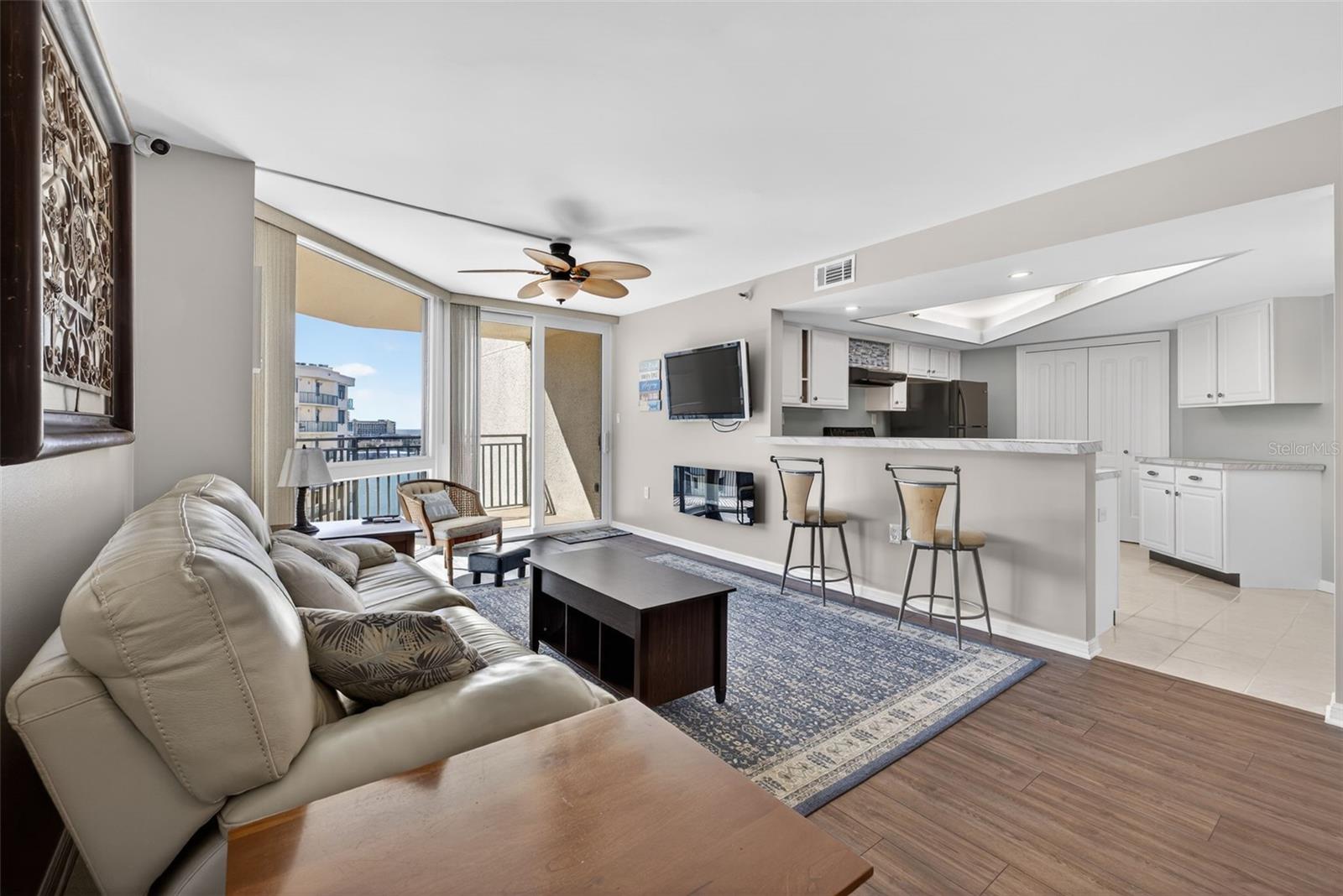 FThe living area has vinyl flooring throughout with a view of the water