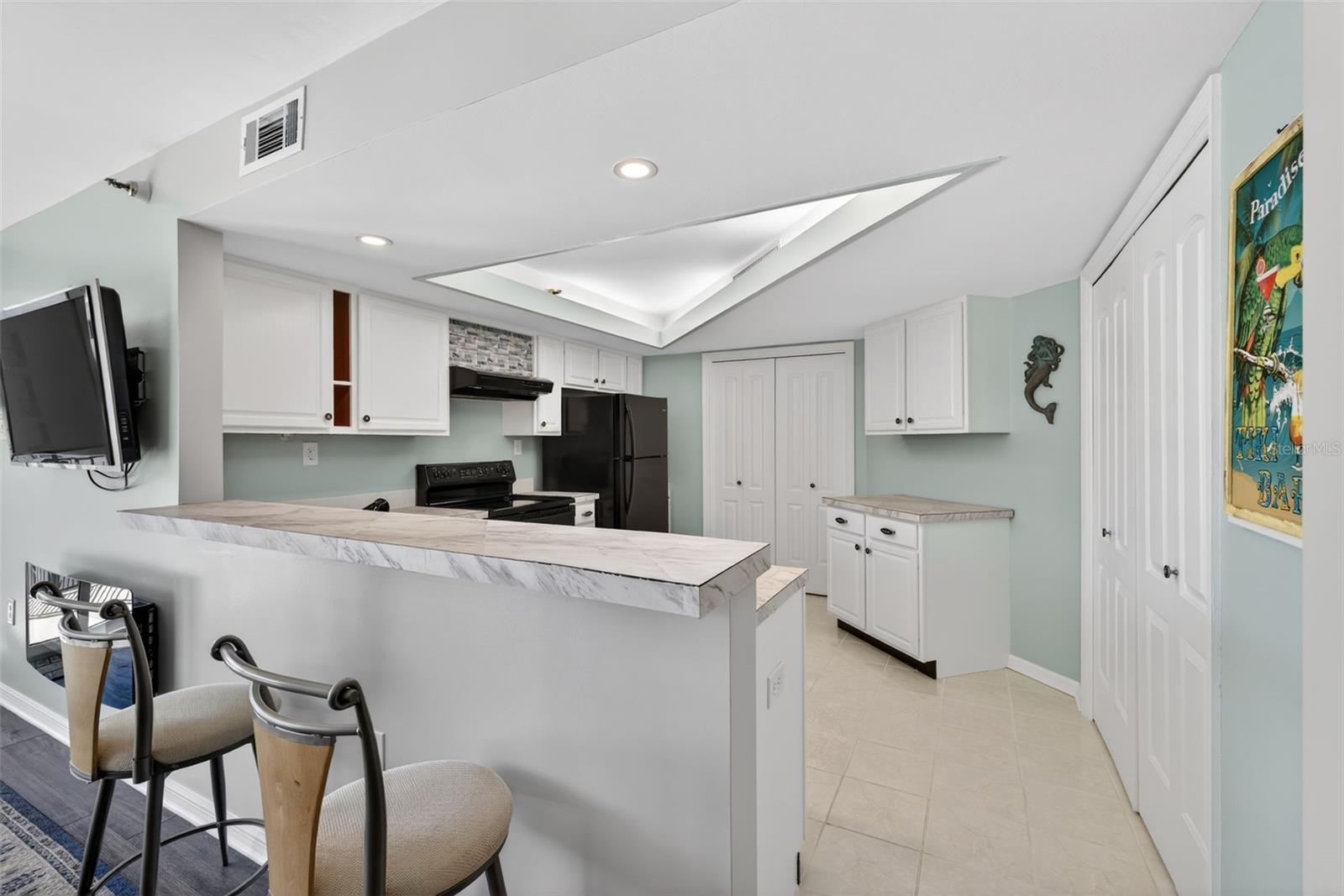 The kitchen is spacious with pleanty of work space