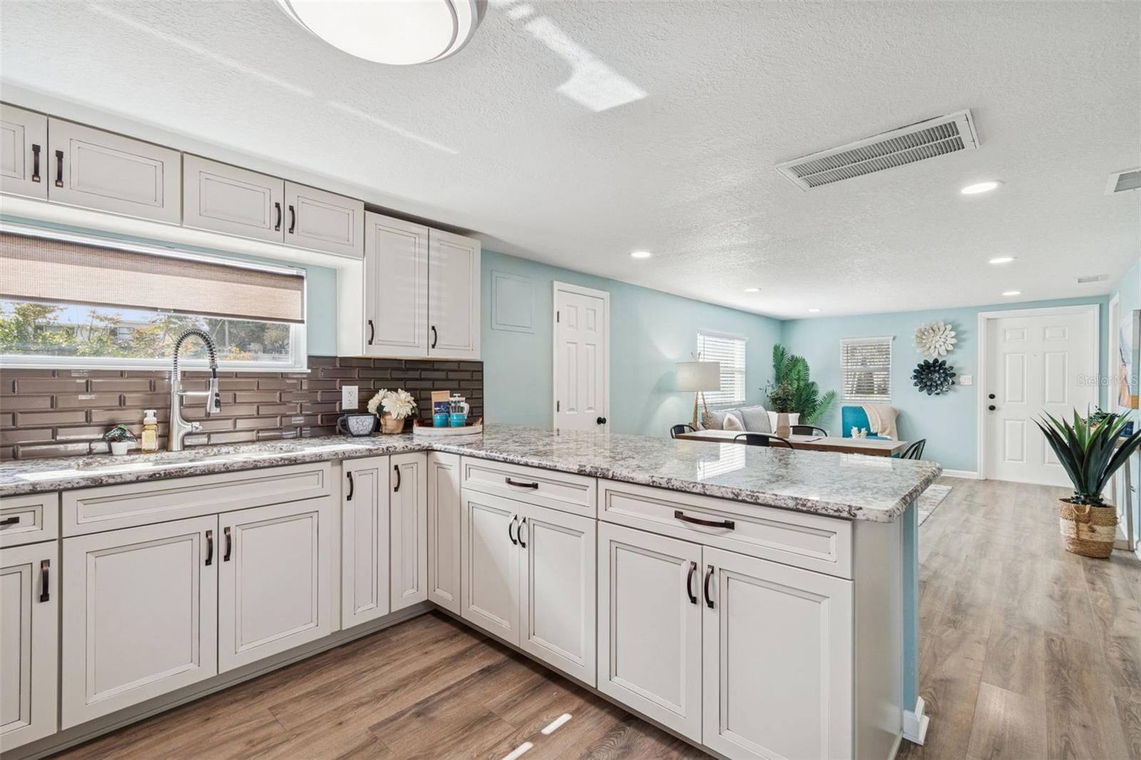Solid wood kitchen cabinets w/ soft close doors, drawers, pull outs, and lazy susan.