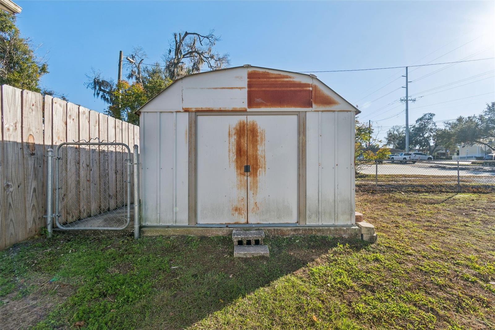 Storage shed on a concrete slab.
