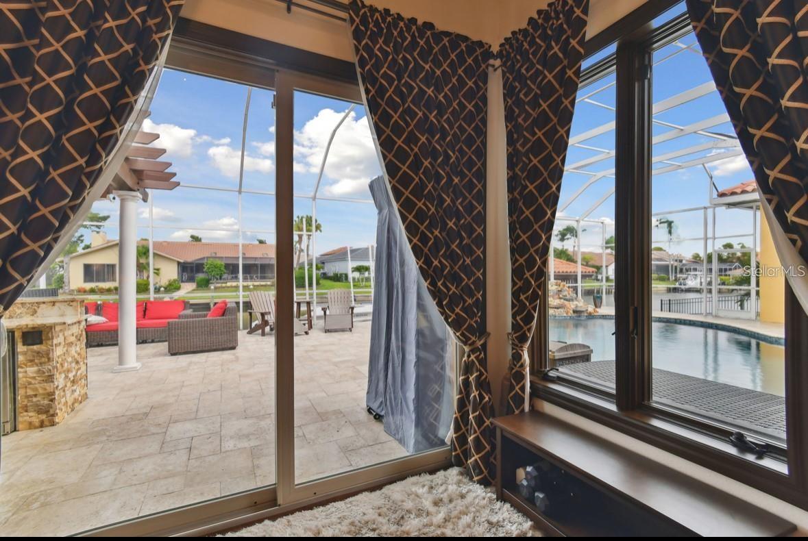 primary bedroom with private access to pool