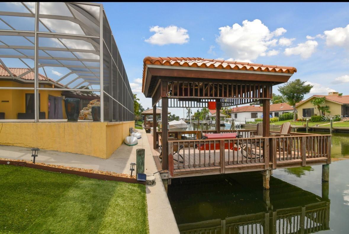 walkway from screened lanai to gazebo and boat dock