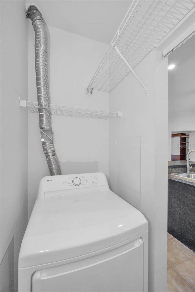 NEWER DRYER AND WASHER (OFF OF KITCHEN)