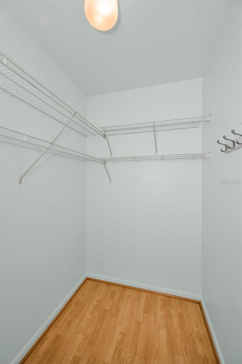 ONE OF TWO LARGE CLOSETS IN PRIMARY BEDROOM