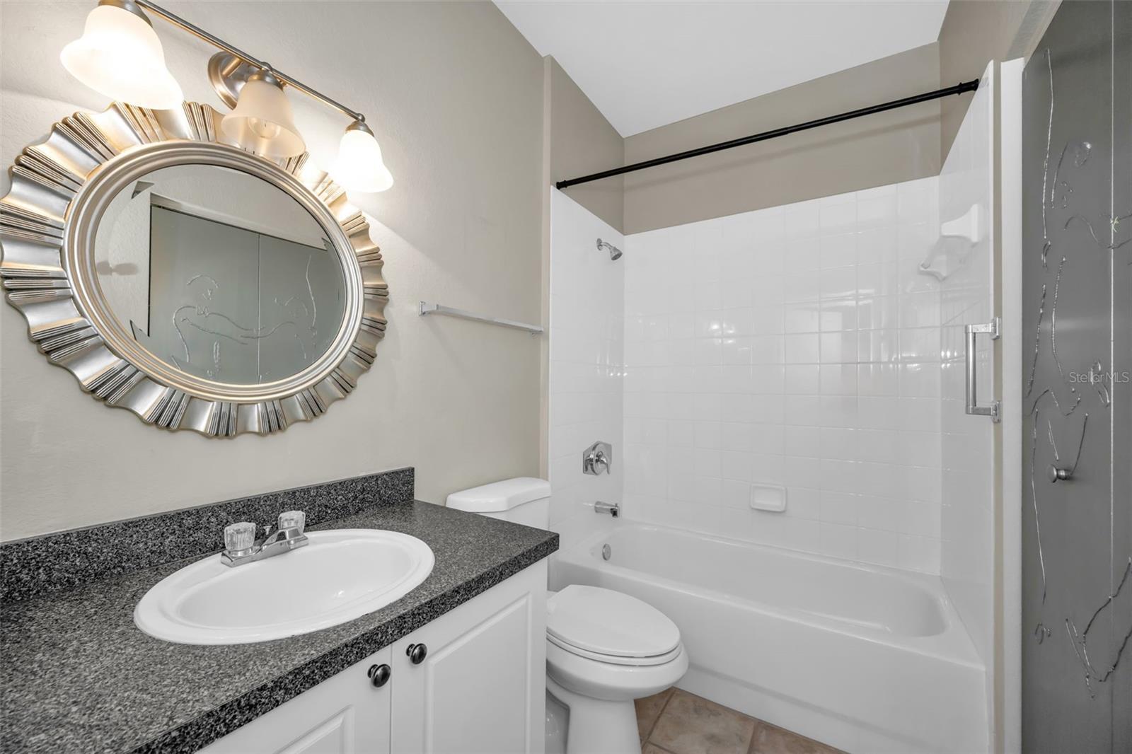 TUB AND HUGE CLOSET IN GUEST BATHROOM