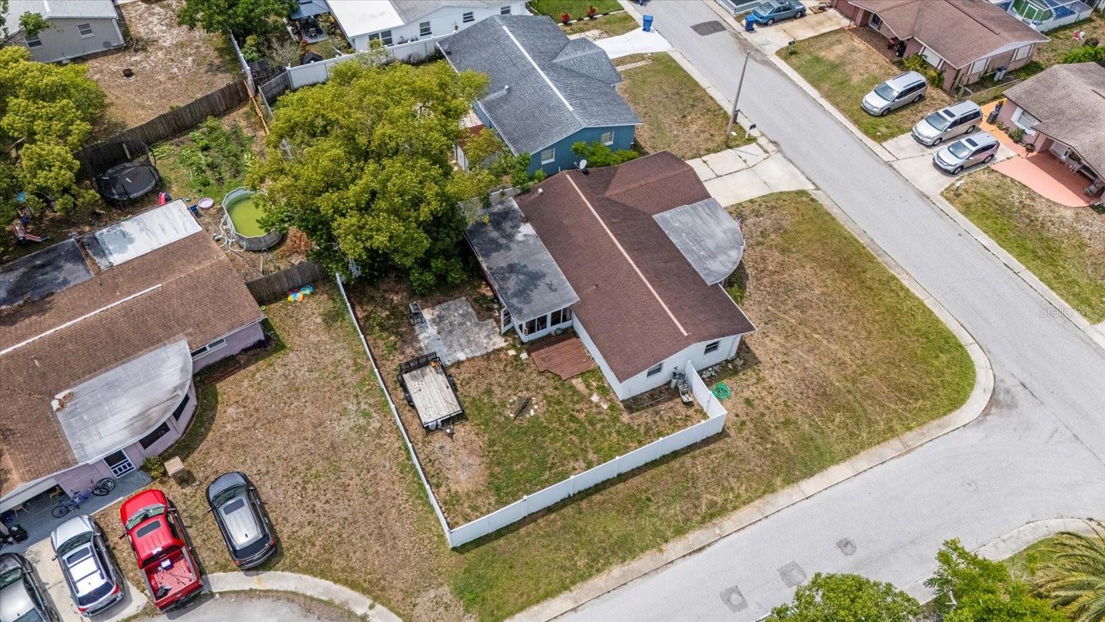 Aerial view of corner lot with PVC privacy fence