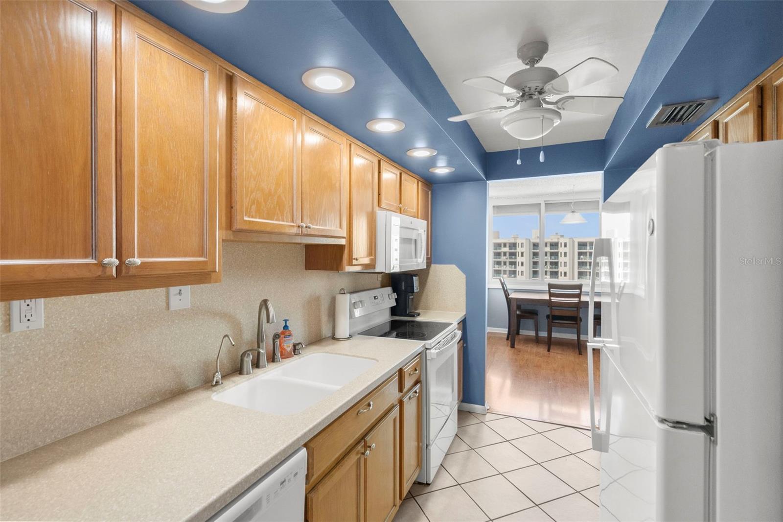 Kitchen has solid surface corian counters