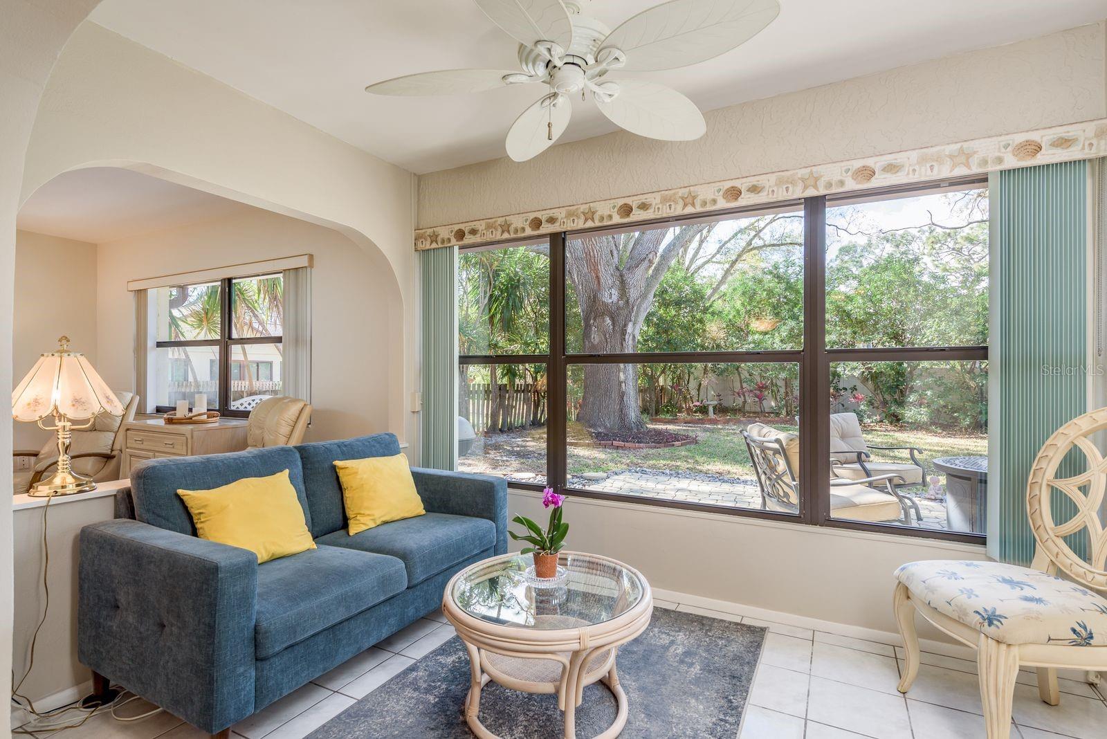 Enclosed porch with backyard views