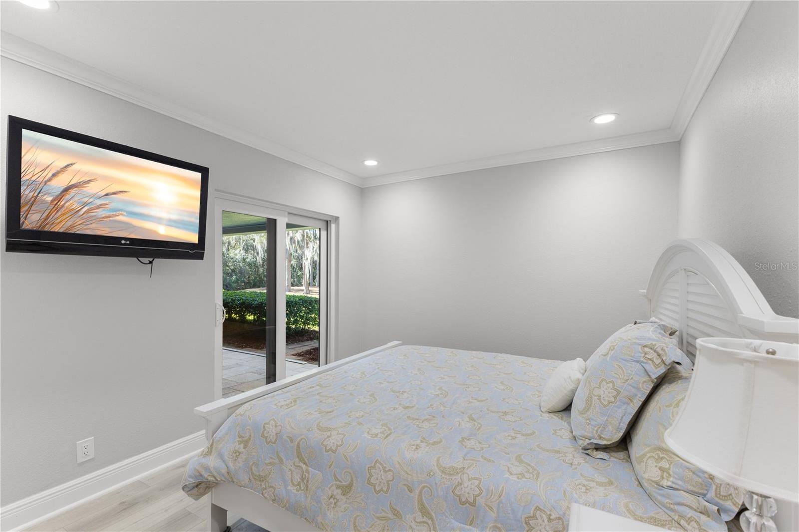 Guest bedroom with brand new sliders to patio