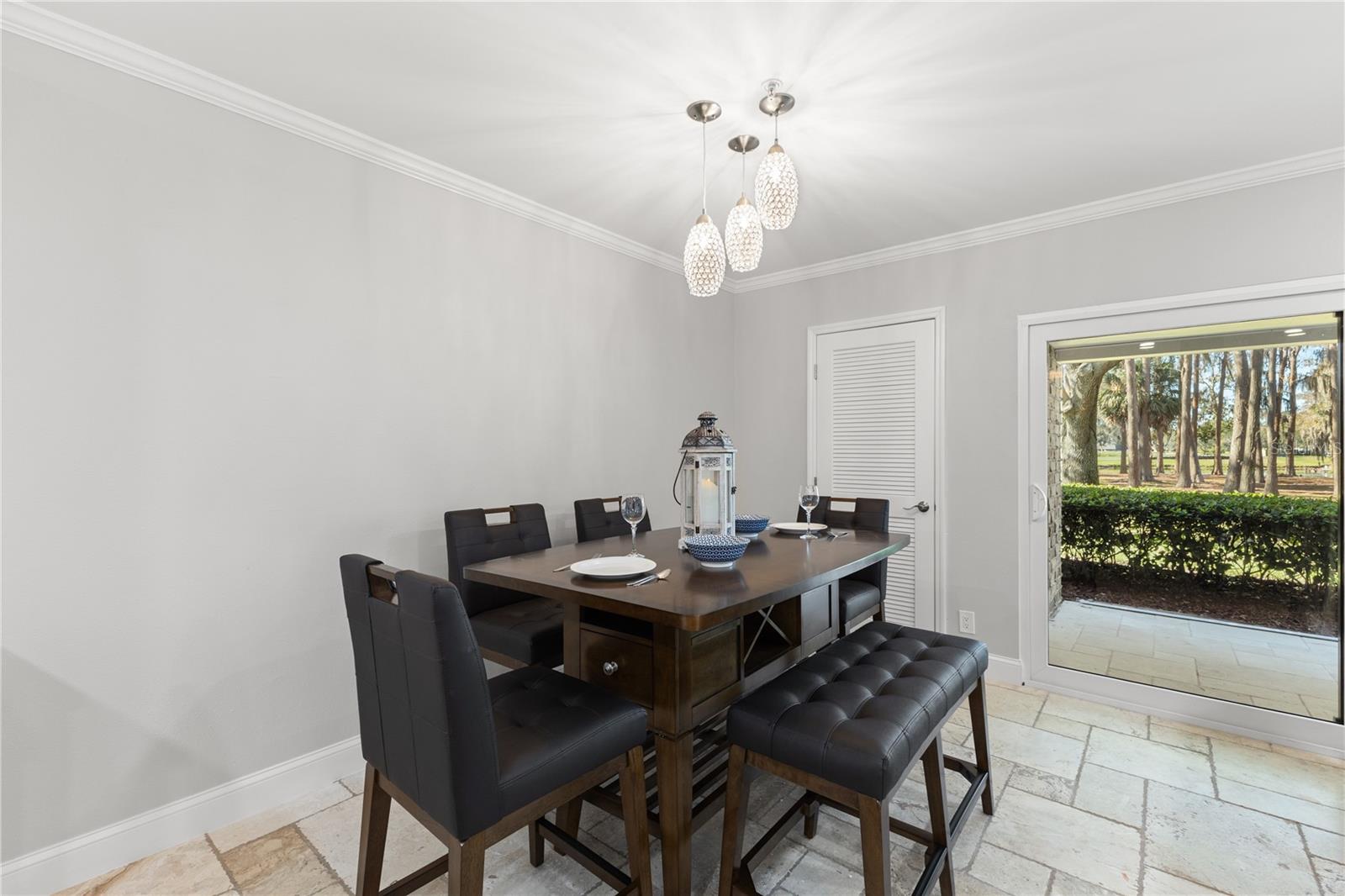 Dining room area with walk in closet for storage and access to patio with brand new Hurricane sliders