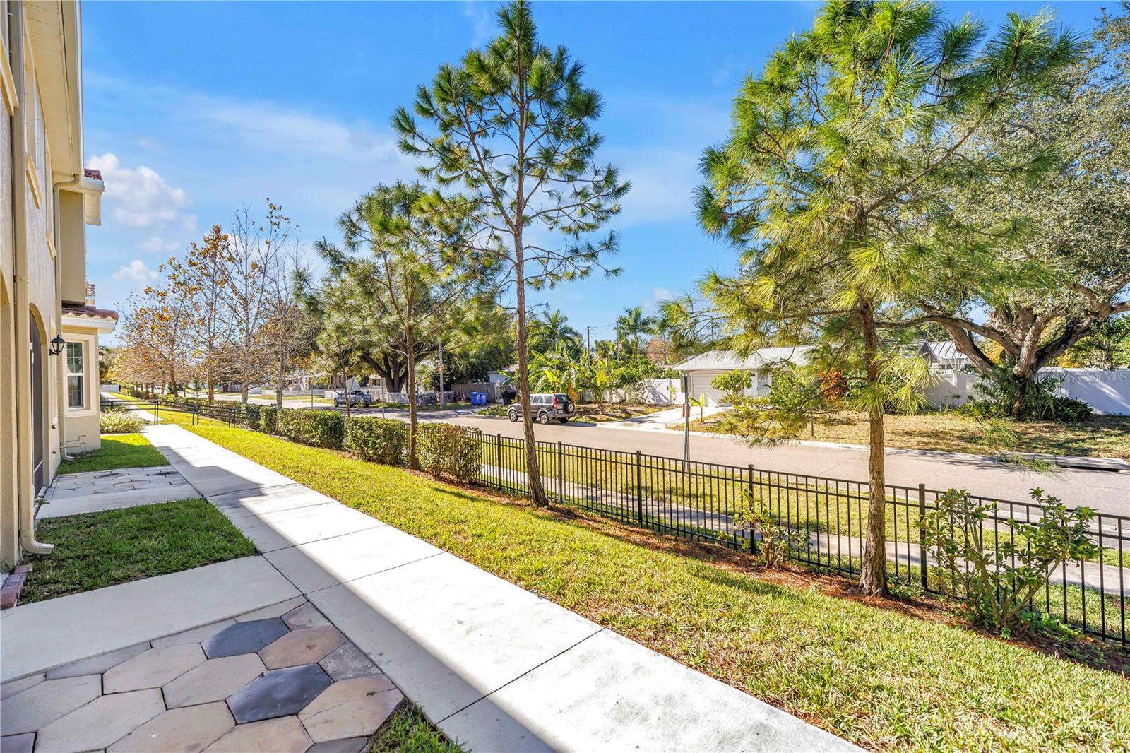 Rear view - there is a secured exit gate on the left that leads out for walks around the neighborhood.