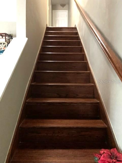 Majestic staircase leads to second level of this exciting residence.