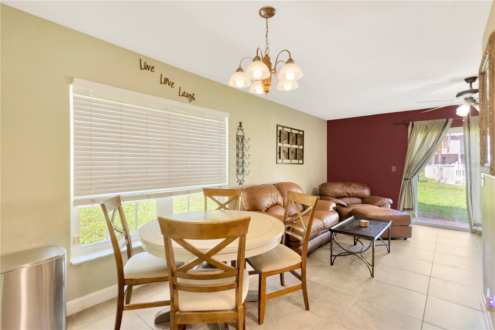 Just to left of kitchen is a designated dining area which flows thru to Family Room and access to back patio thru a set of sliders.