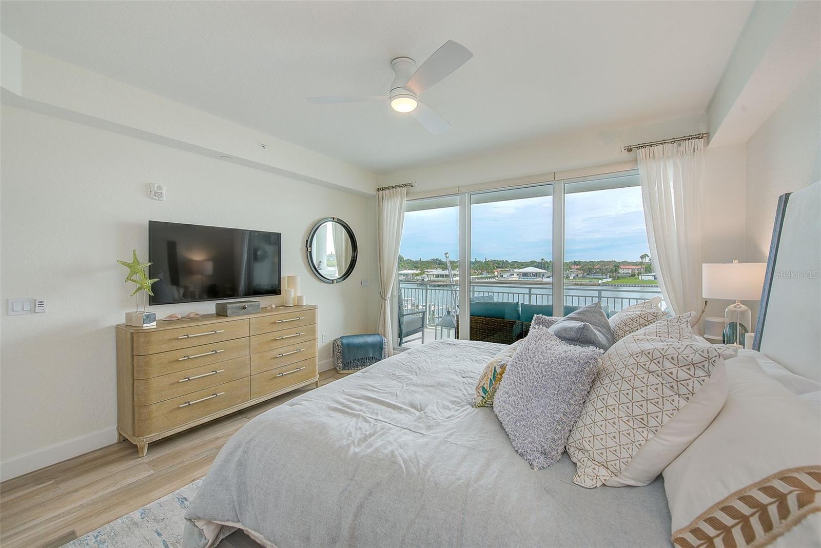 Primary bedroom with amazing waterfront views.