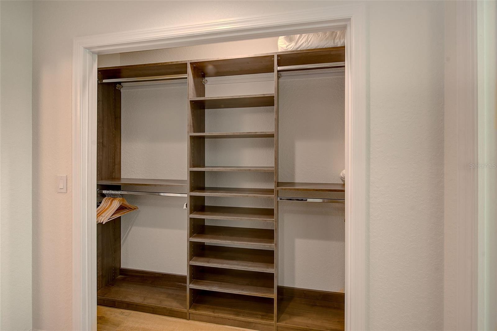 Primary bedroom with his and hers closets.