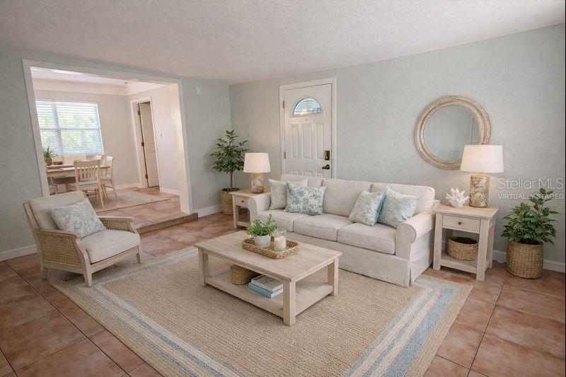 The bonus room features a door that leads to the fenced backyard.  (Photo has been virtually staged to illustrate potential use of space).